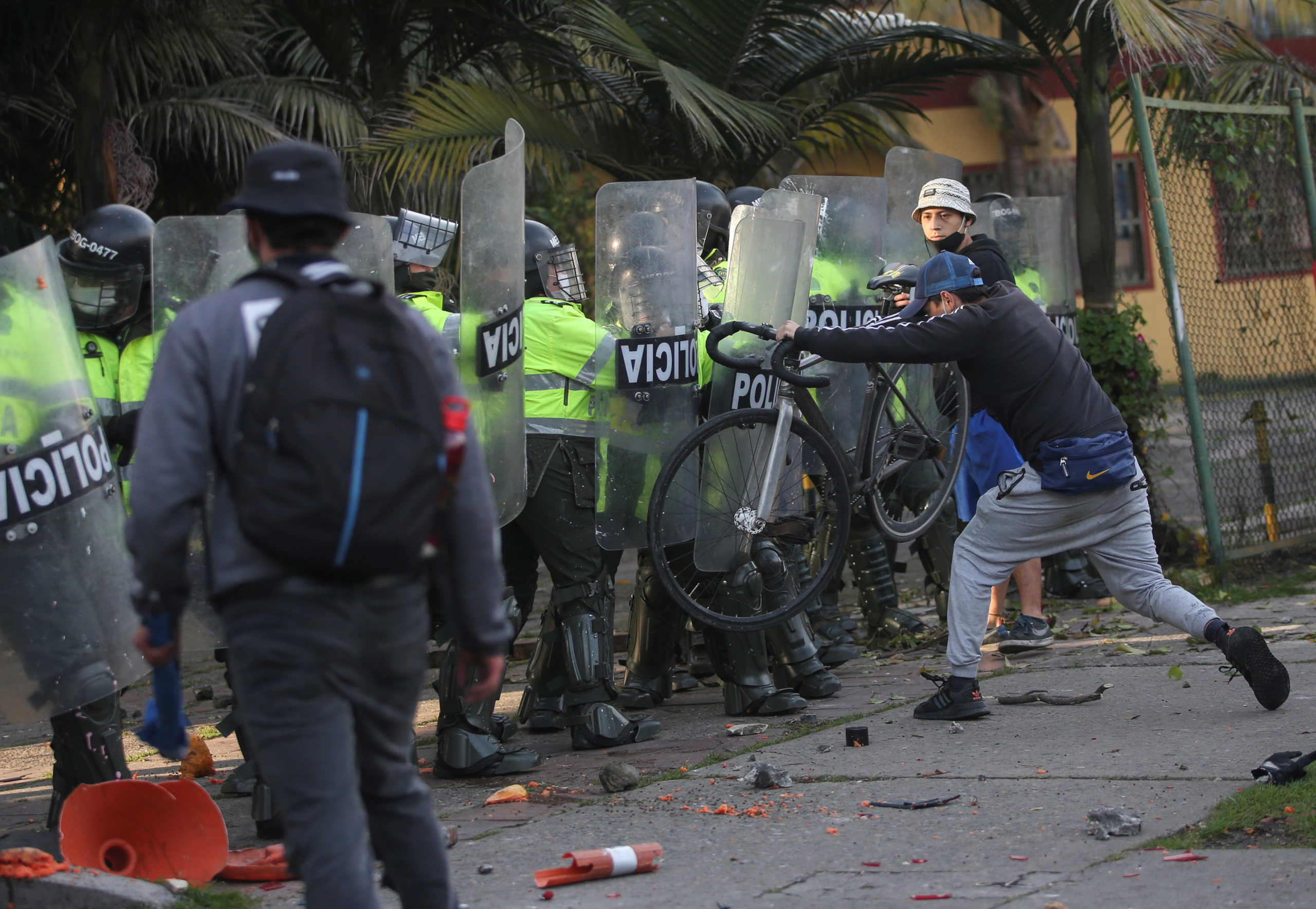 Demonstrators clash with police after a man, who was detained for violating social distancing rules, died from being repeatedly shocked with a stun gun by officers, according to authorities, in Bogota, Colombia September 9, 2020. REUTERS
