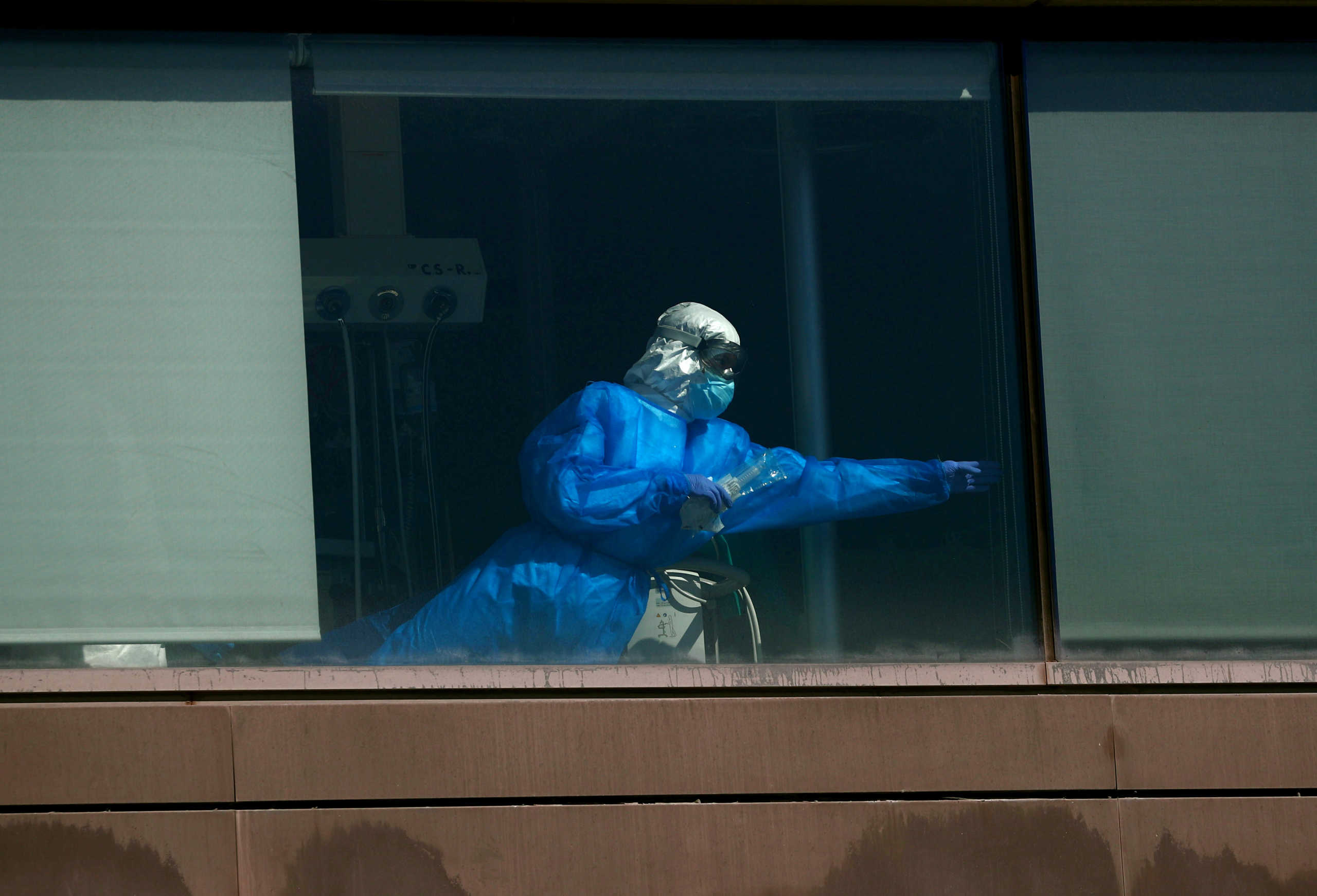 A health worker stands inside Intensive Care Unit at La Paz hospital amid the outbreak of the coronavirus disease (COVID-19), in Madrid, Spain September 28, 2020. REUTERS