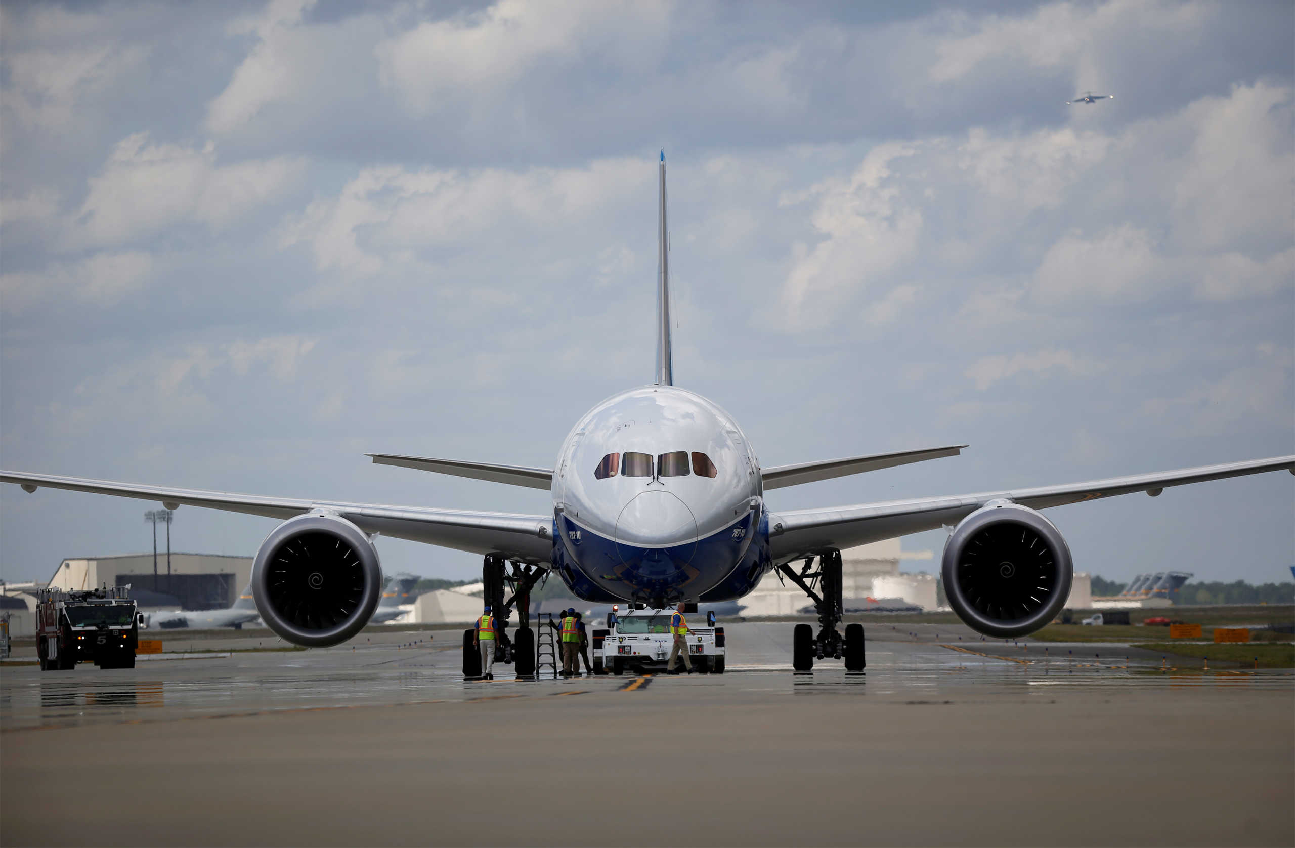 FILE PHOTO: Workers check over the new Boeing 787-10 Dreamliner after its first test flight at the Charleston International Airport in North Charleston, South Carolina, United States March 31, 2017.  REUTERS