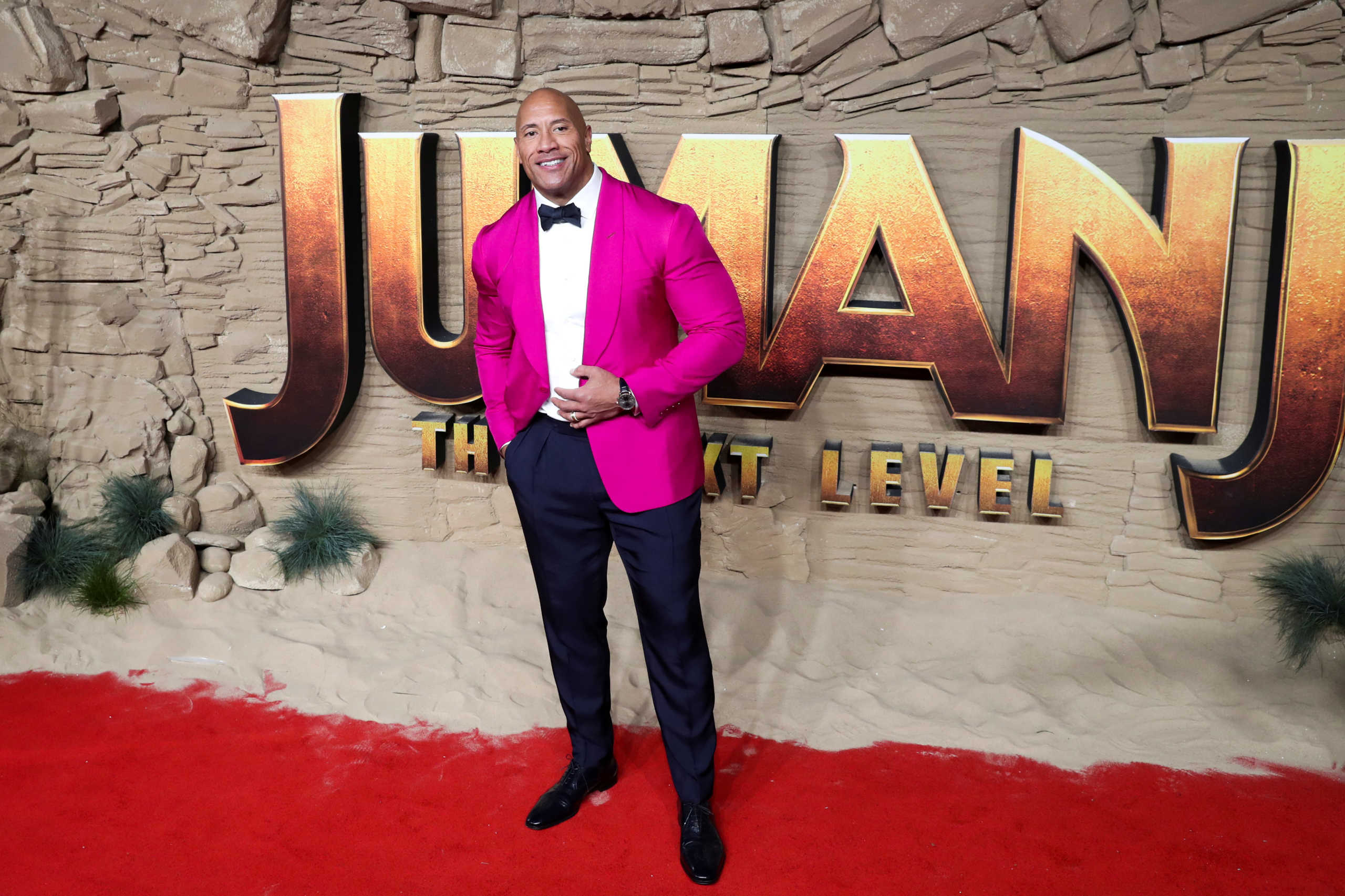FILE PHOTO: Actor Dwayne Johnson poses as he arrives to the premiere of "Jumanji: The Next Level" in London, Britain December 5, 2019. REUTERS