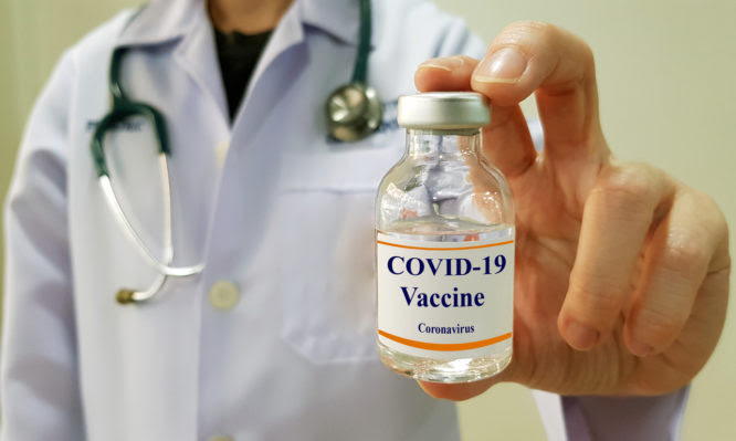 Doctor show COVID 19  vaccine for prevention and treatment new corona virus infection(COVID-19,novel coronavirus disease 2019 or nCoV 2019