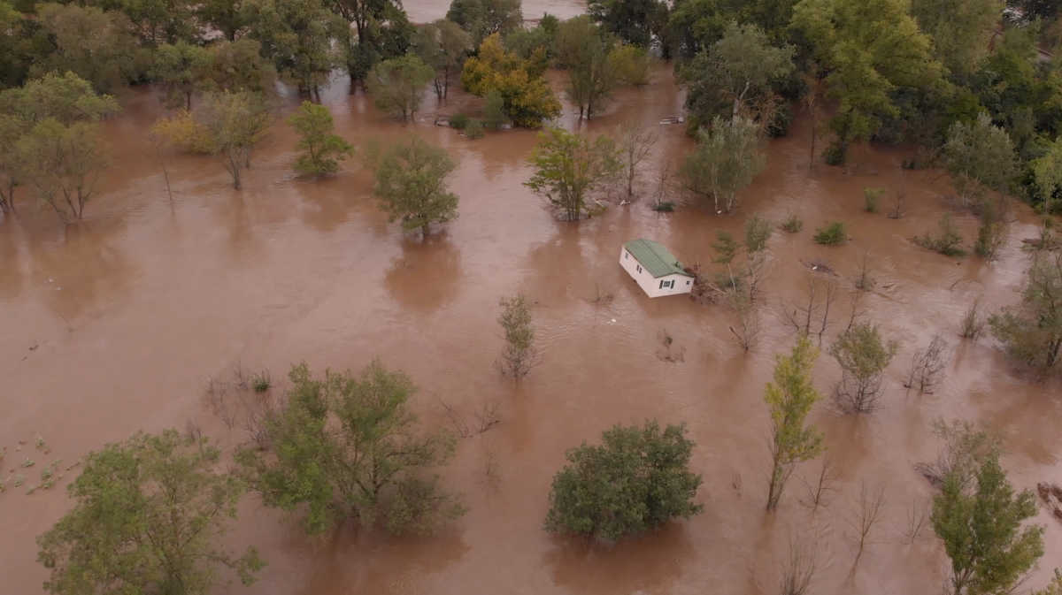 A house floats down the river after flash flooding occurred in the region, in Anduze, France September 19, 2020, in this still image taken from a video obtained from social media. Facebook