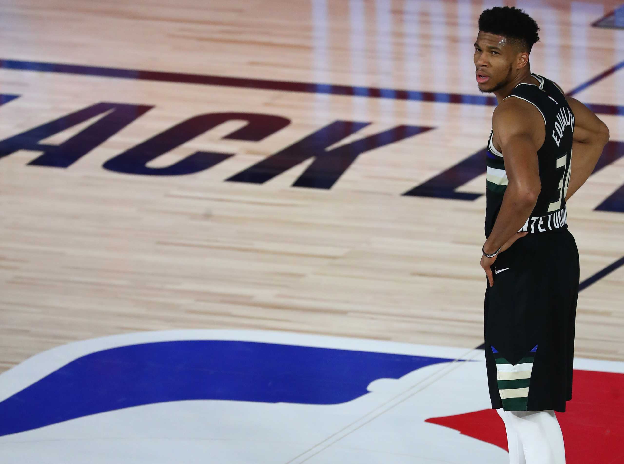 Sep 2, 2020; Lake Buena Vista, Florida, USA; Milwaukee Bucks forward Giannis Antetokounmpo (34) looks on during the first half of game two of the second round of the 2020 Stanley Cup Playoffs against the Miami Heat at The Field House. Mandatory Credit: Kim Klement-USA TODAY Sports