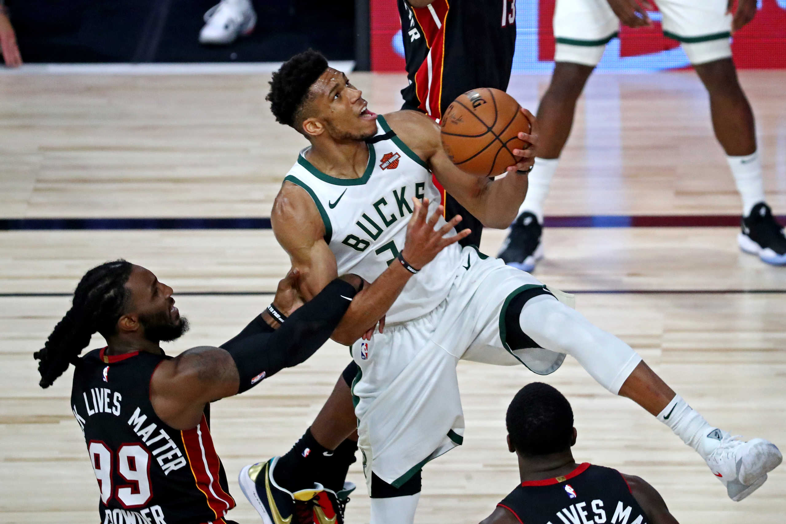 Sep 4, 2020; Lake Buena Vista, Florida, USA; Milwaukee Bucks forward Giannis Antetokounmpo (34) drives to the basket against Miami Heat forward Jae Crowder (99) during the third quarter in game three of the second round of the 2020 NBA Playoffs at ESPN Wide World of Sports Complex. Mandatory Credit: Kim Klement-USA TODAY Sports