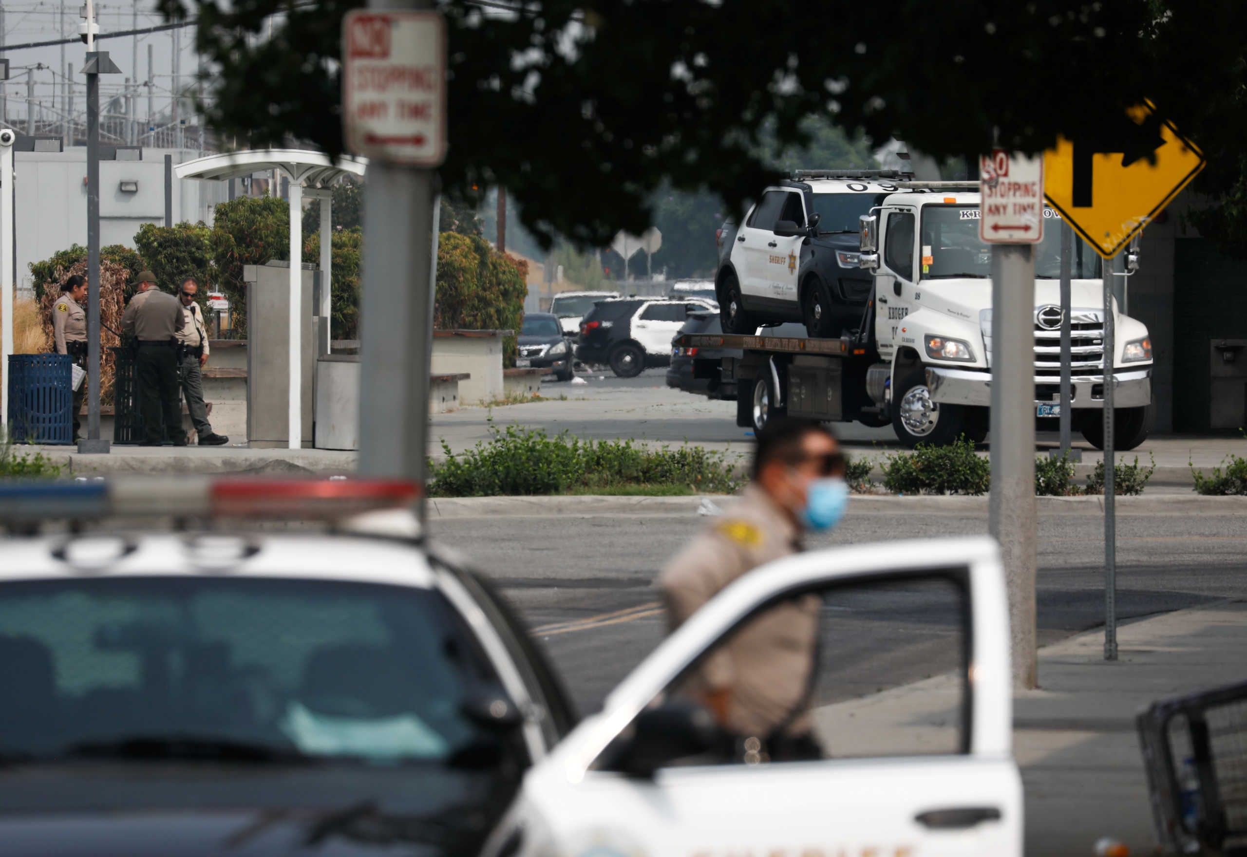 A Los Angeles County Sheriffs Department vehicle is towed from the scene where two deputies were shot in an ambush style shooting in Compton, California, U.S., September 13, 2020. REUTERS