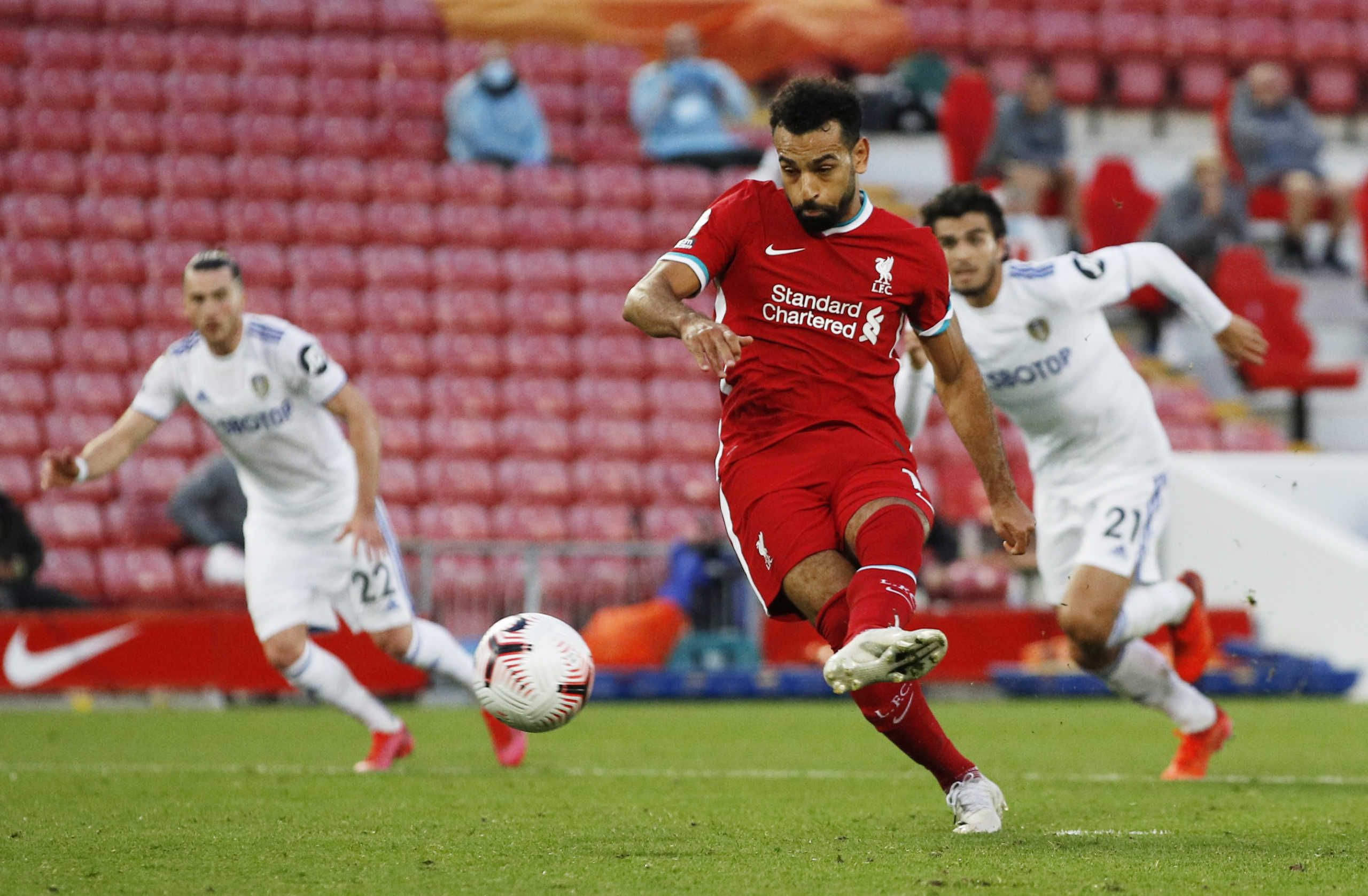 Soccer Football - Premier League - Liverpool v Leeds United - Anfield, Liverpool, Britain - September 12, 2020 Liverpool's Mohamed Salah scores their fourth goal to complete his hat-trick. Pool via REUTERS