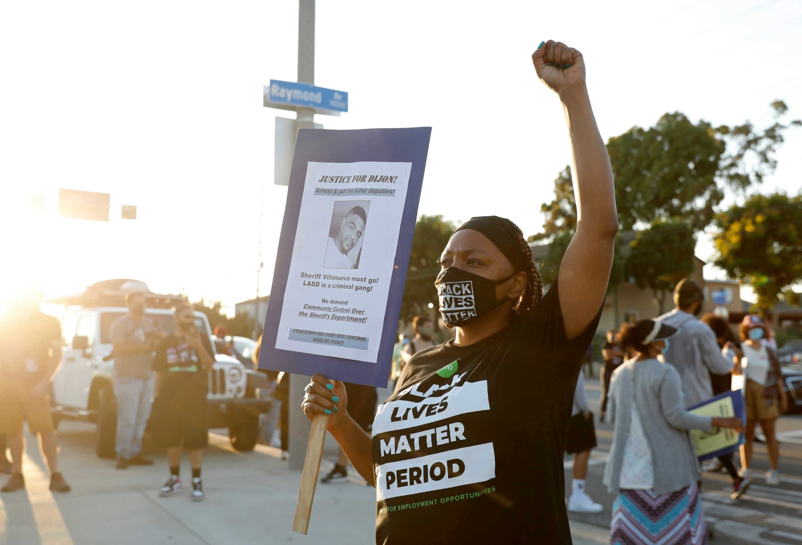 A demonstrator holds a sign reading "Justice for Dijon" during a protest against the shooting of Dijon Kizzee by Los Angeles sheriff's deputies, in Los Angeles, California, U.S., September 1, 2020. REUTERS