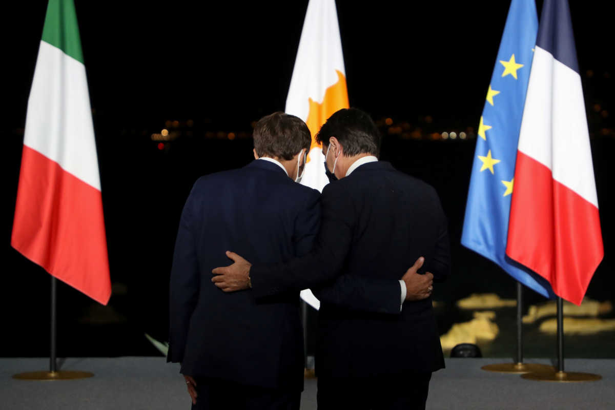 Italy's Prime Minister Giuseppe Conte and France's President Emmanuel Macron speak after the closing news conference of the seventh MED7 Mediterranean countries summit in Porticcio, on the Mediterranean Island of Corsica, France September 10, 2020. Ludovic Marin