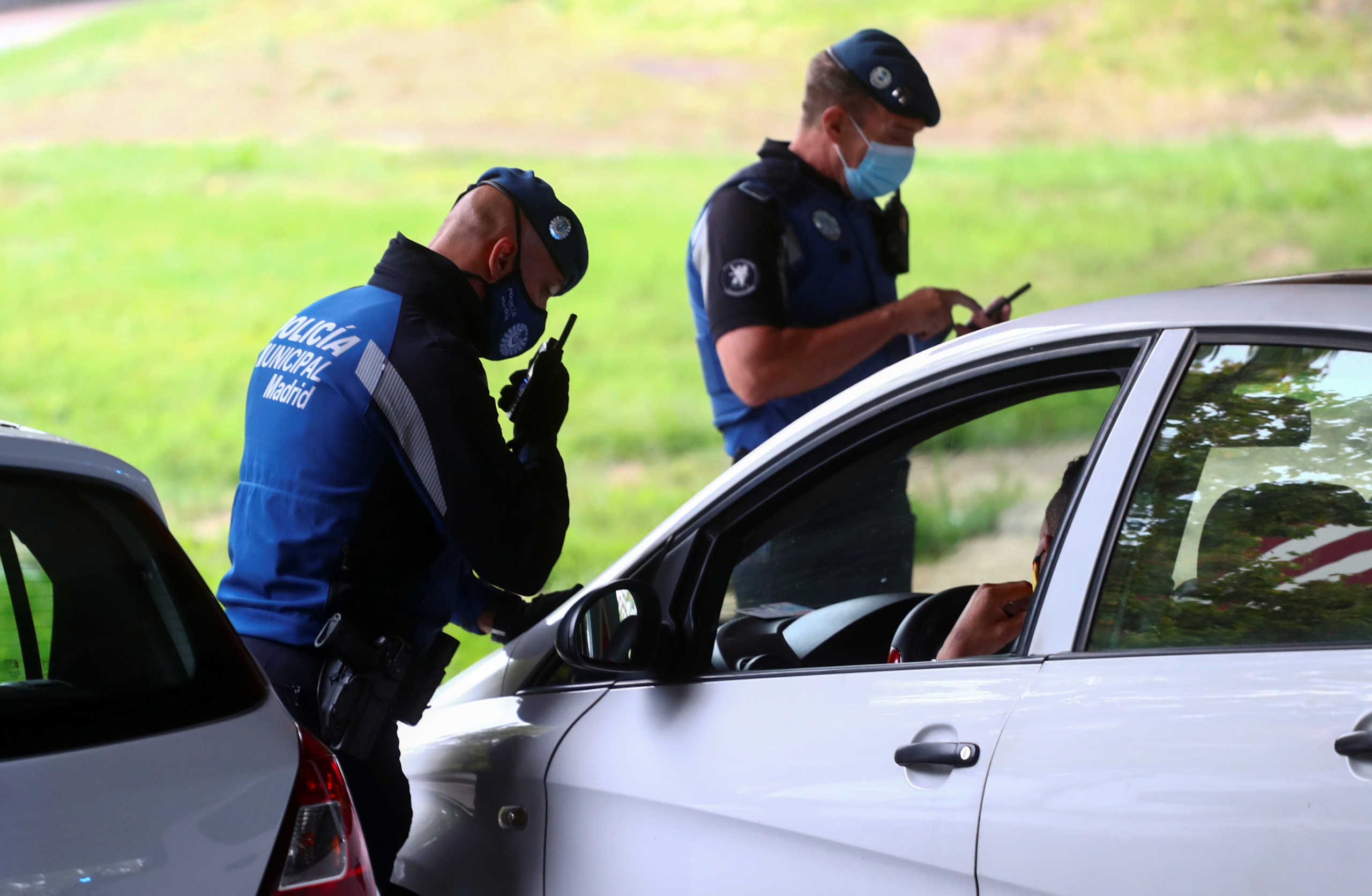 Local police officers work at a checkpoint in the Villaverde neighbourhood during a partial lockdown between and within areas in six districts, amid the outbreak of the coronavirus disease (COVID-19), in Madrid, Spain September 23, 2020. REUTERS