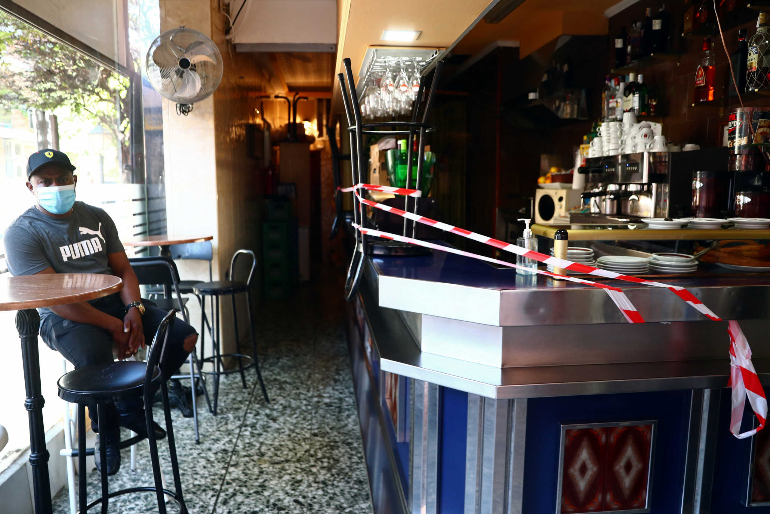 A bar counter is sealed off to prevent contact between customers at the Vallecas neighbourhood, amid the coronavirus disease (COVID 19) outbreak in Madrid, Spain, September 25, 2020. REUTERS