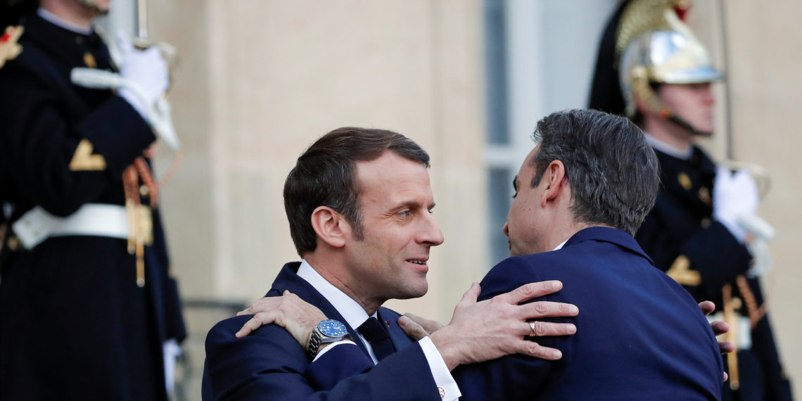 French President Emmanuel Macron welcomes Greek Prime Minister Kyriakos Mitsotakis at the Elysee Palace in Paris, France January 29, 2020. REUTERS
