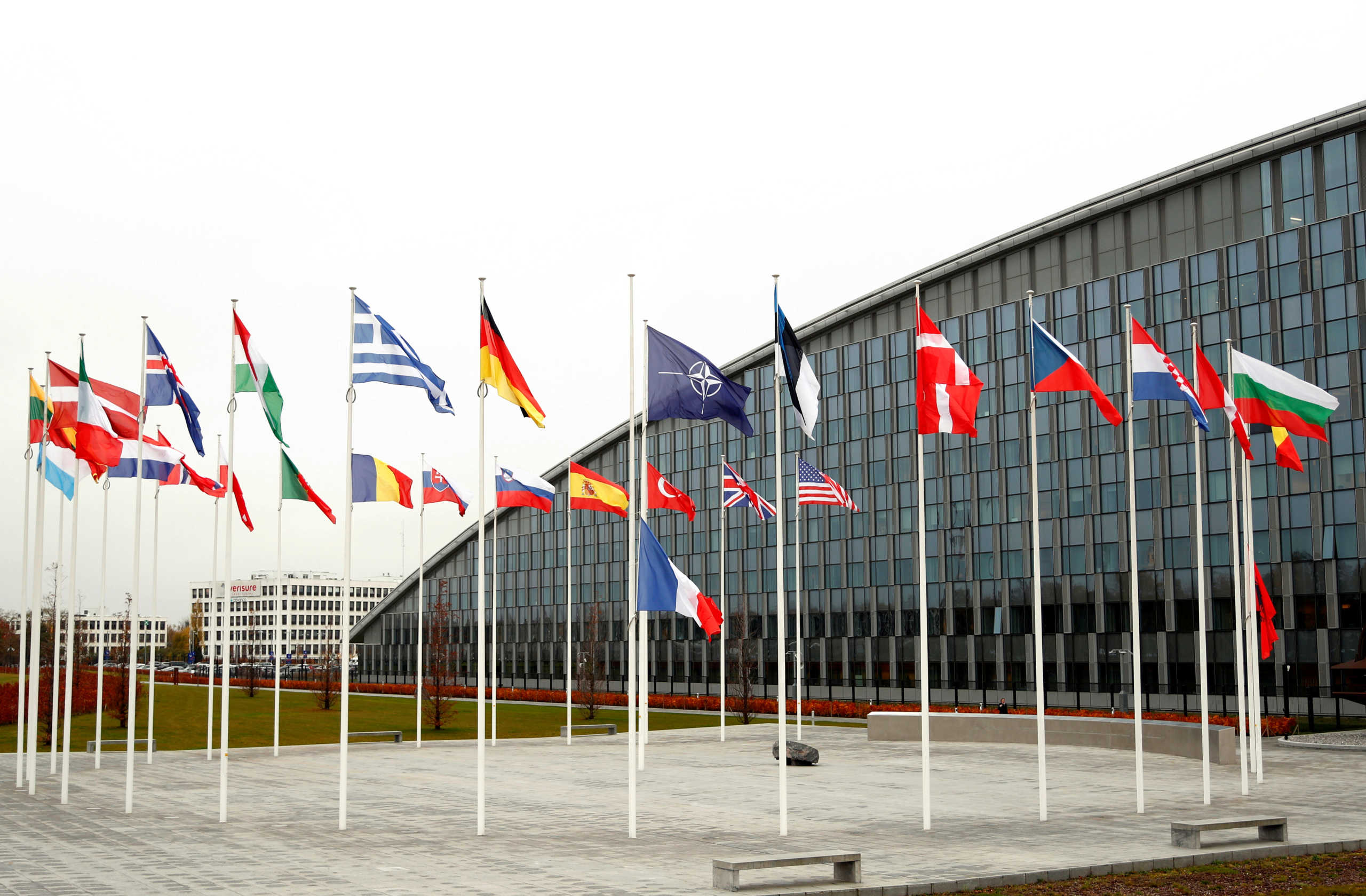 FILE PHOTO: Flags of NATO member countries are seen at the Alliance headquarters in Brussels, Belgium, November 26, 2019.  REUTERS