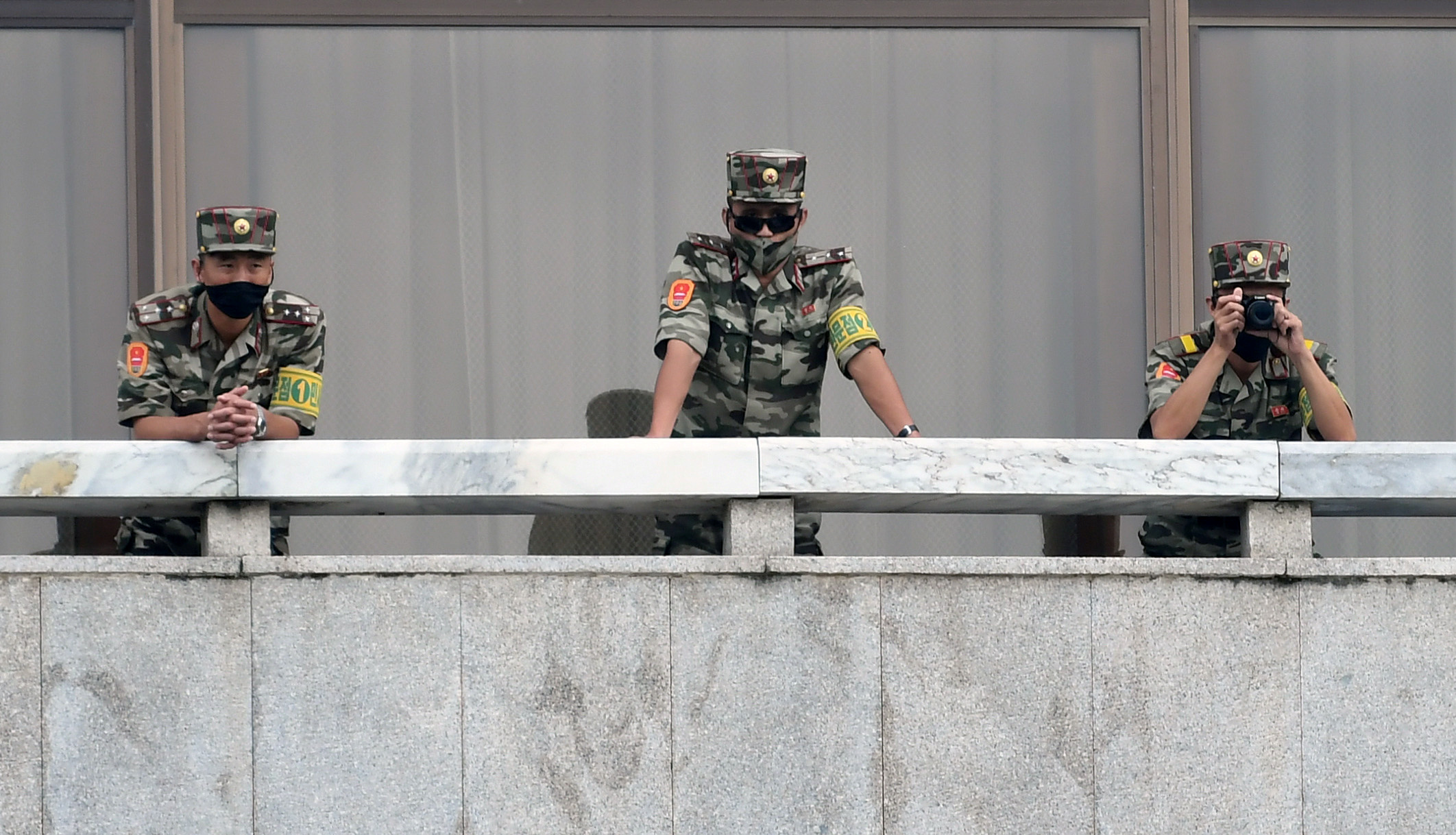 North Korean soldiers keep watch toward the south as South Korean Unification Minister Lee In-young inspects (not pictured) the truce village of Panmunjom inside the demilitarized zone separating the two Koreas, South Korea, September 16, 2020.  Korea Pool