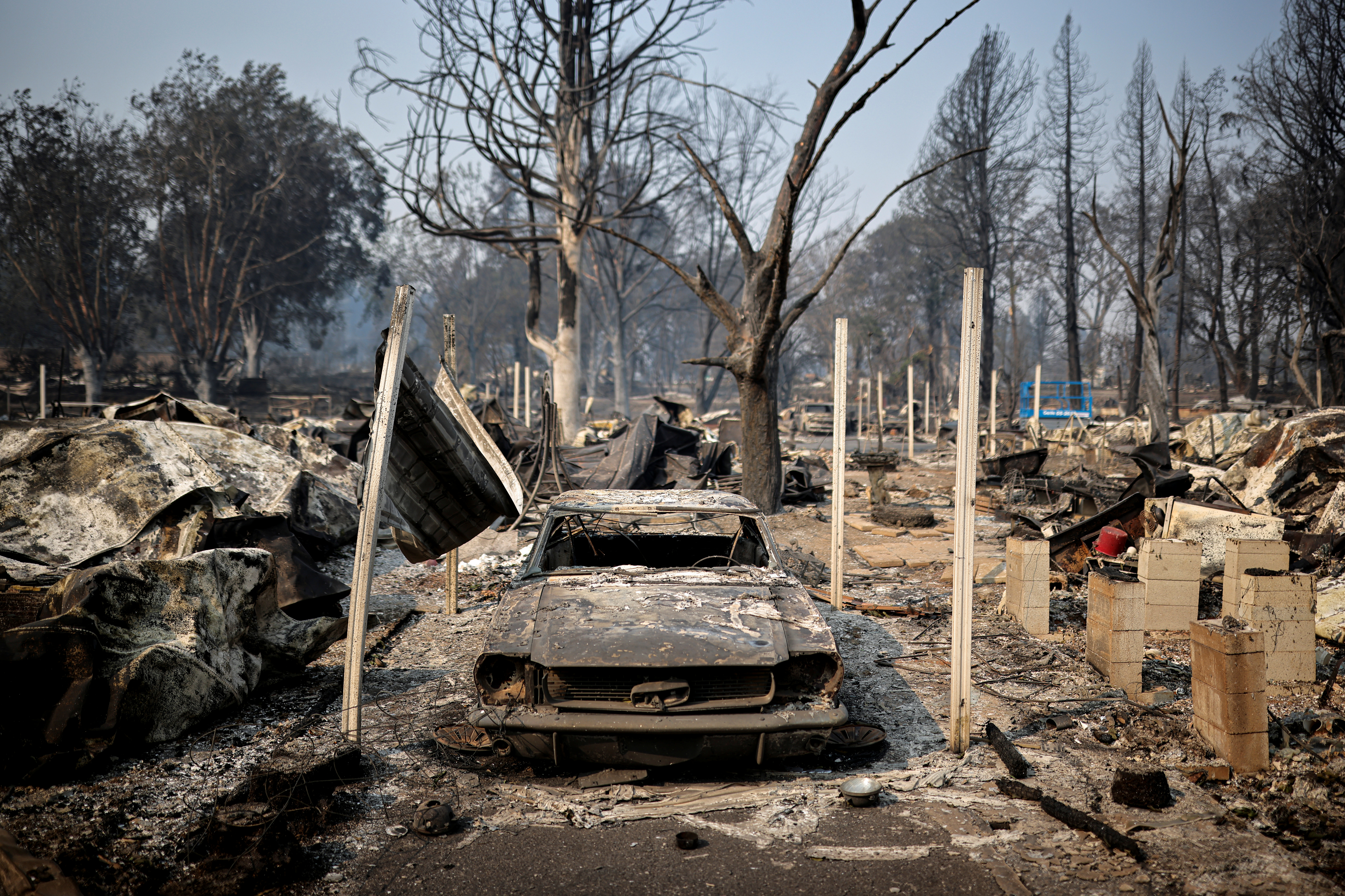 Burned car is seen in a neighbourhood after wildfires destroyed an area of Phoenix, Oregon, U.S., September 10, 2020. REUTERS