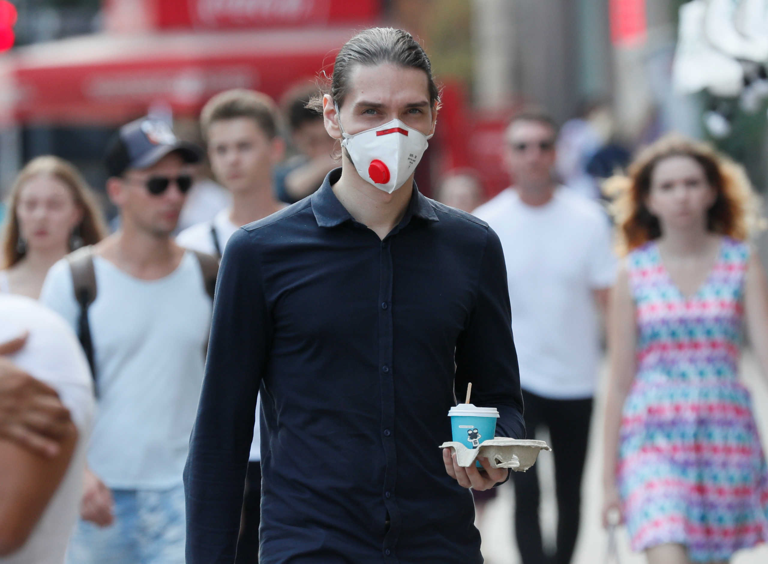 A man wearing a protective face mask amid the outbreak of the coronavirus disease (COVID-19) crosses a street in central Kyiv, Ukraine August 21, 2020. REUTERS
