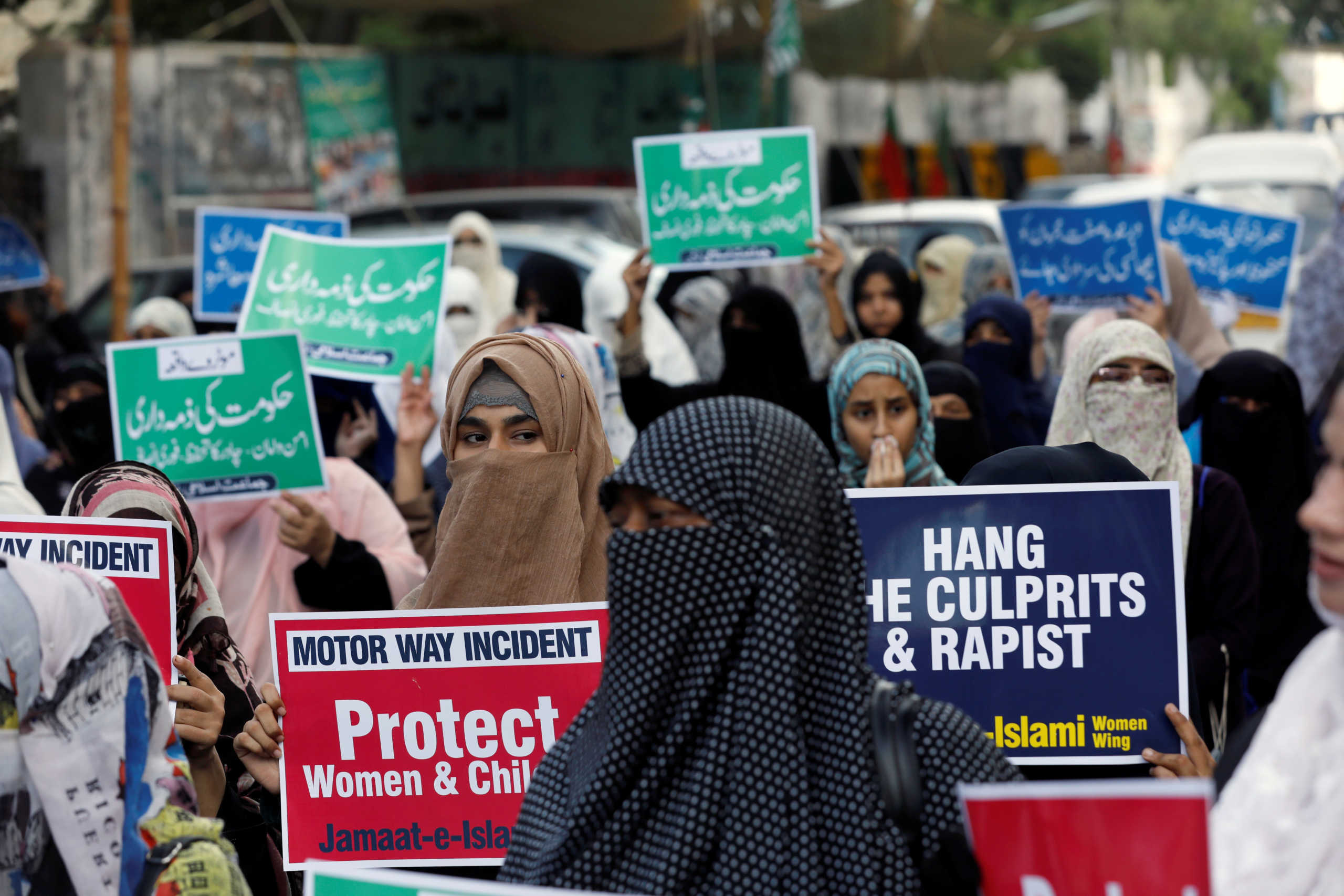 Supporters of religious and political party Jamaat-e-Islami (JI) carry signs against a gang rape that occured along a highway, and to condemn the violence against women and girls, during a demonstration in Karachi, Pakistan September 11, 2020. REUTERS