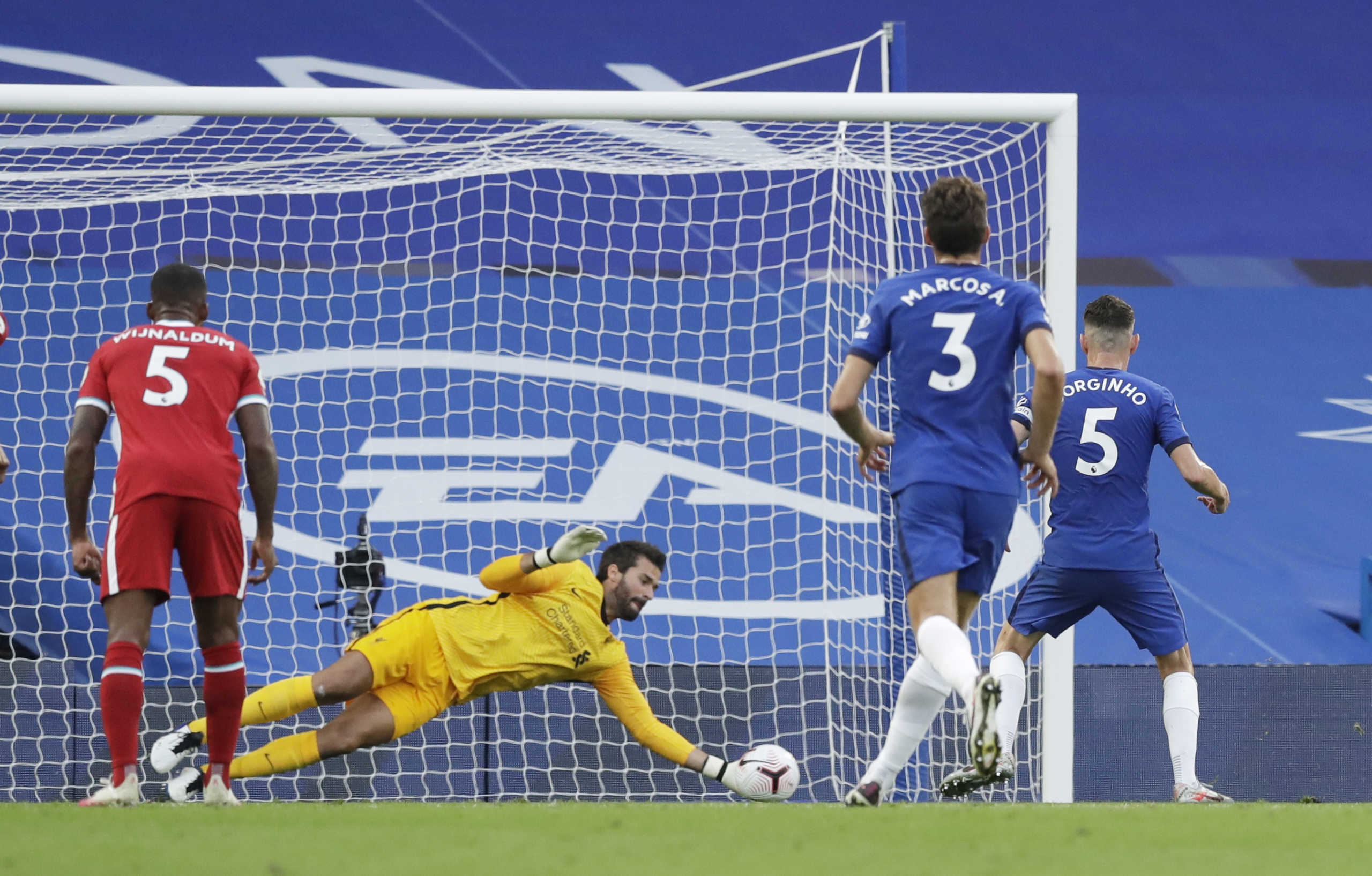 Soccer Football - Premier League - Chelsea v Liverpool - Stamford Bridge, London, Britain - September 20, 2020 Liverpool's Alisson saves a penalty from Chelsea's Jorginho Pool via REUTERS