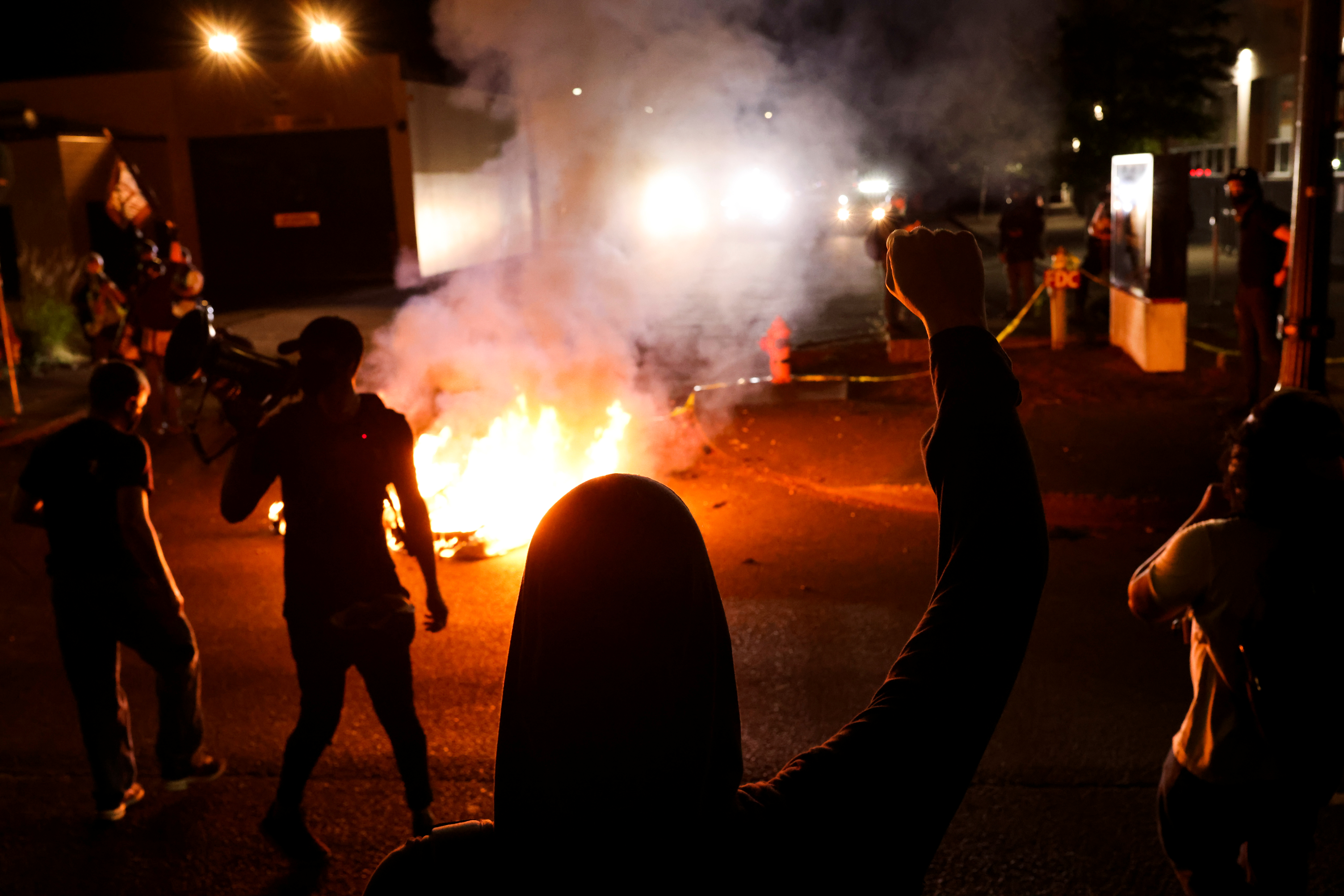 Protesters gather outside the Portland Police Bureau's North Precinct on the 101th consecutive night of protests against police violence and racial inequality, in Portland, Oregon, U.S. September 6, 2020.REUTERS