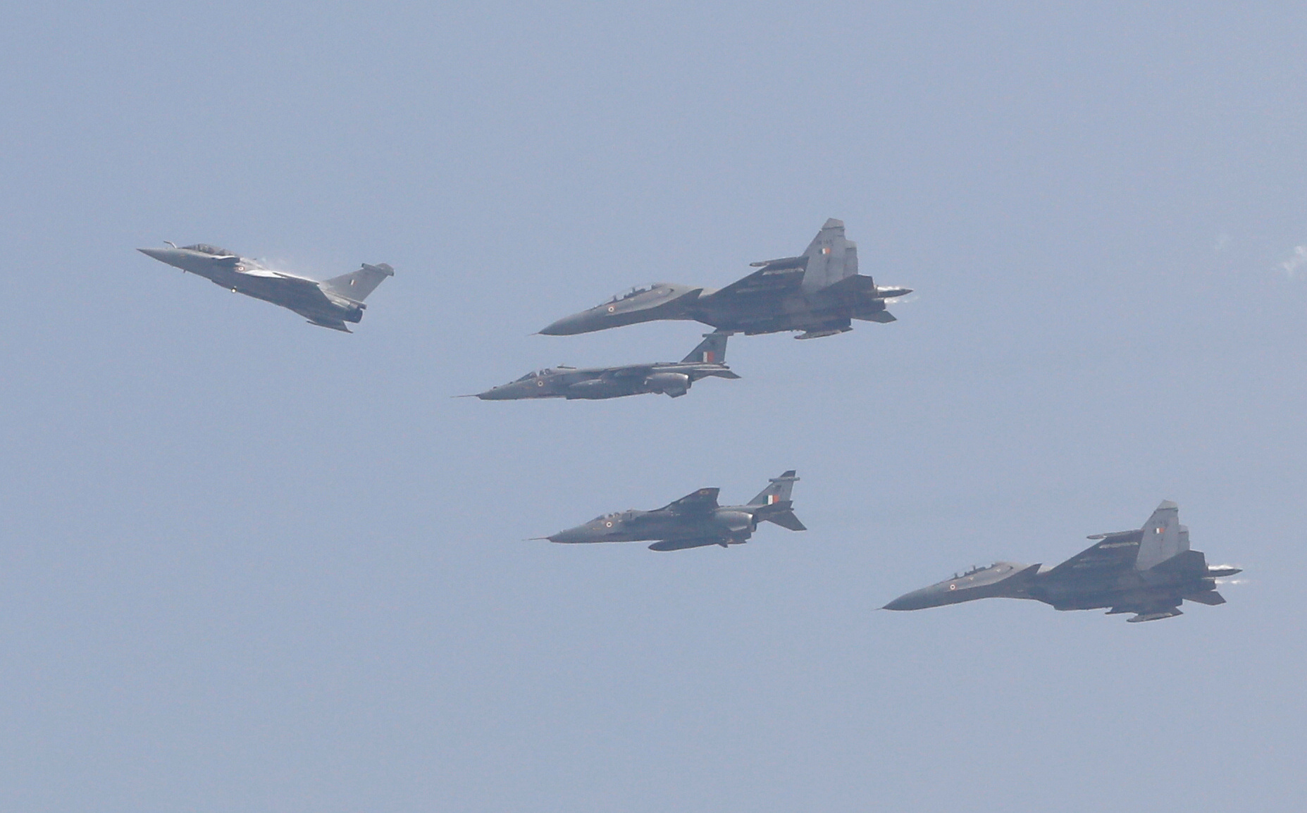 A Rafale fighter jet, flanked by Sukhoi Su-30 and SEPECAT Jaguar jets, fly during its induction ceremony at an air force station in Ambala, India, September 10, 2020. REUTERS
