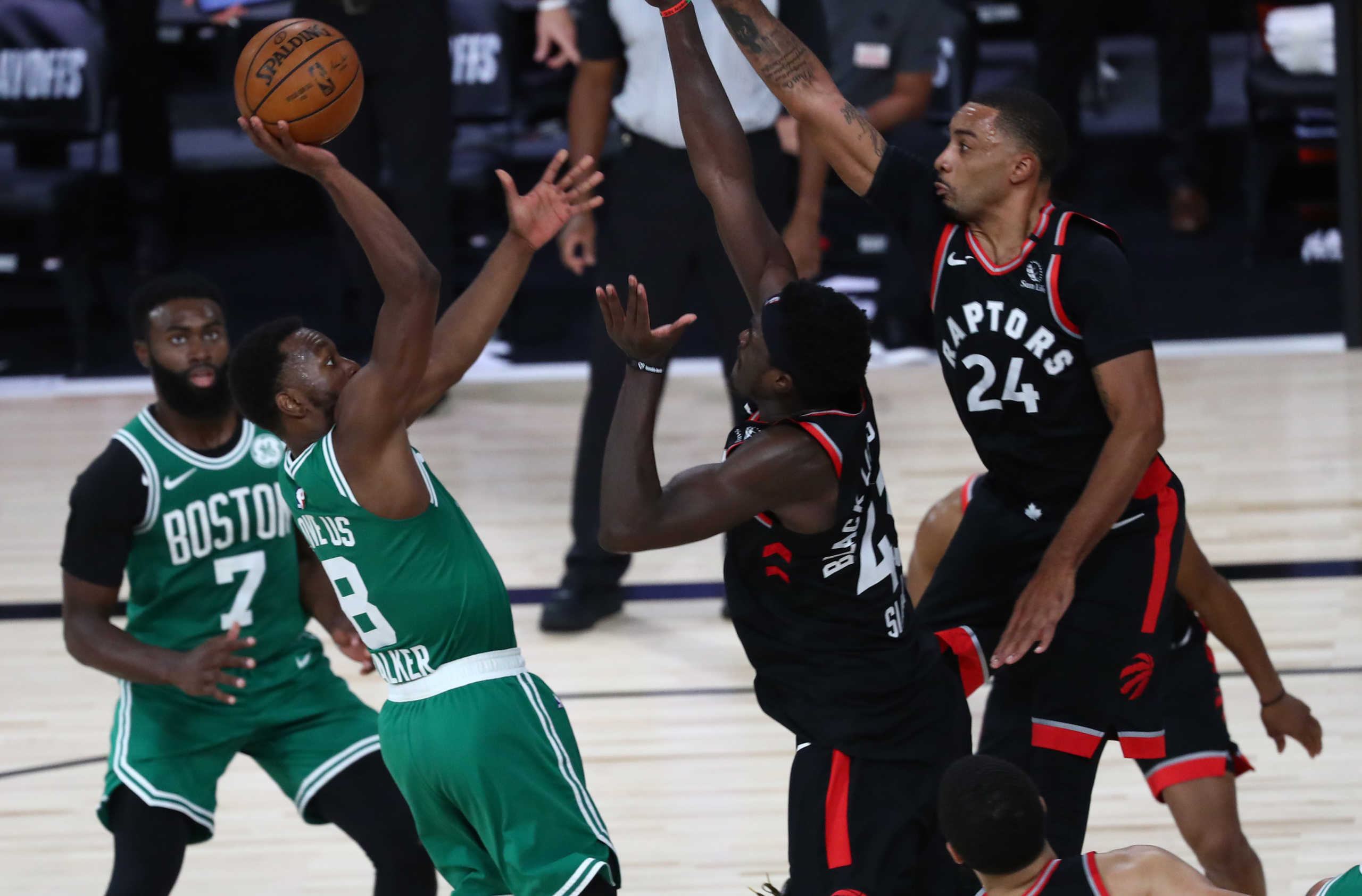 Sep 9, 2020; Lake Buena Vista, Florida, USA; Boston Celtics guard Kemba Walker (8) shoots against Toronto Raptors guard Norman Powell (24) and forward Pascal Siakam (43) in the second half in game six of the second round of the 2020 NBA Playoffs at ESPN Wide World of Sports Complex. Mandatory Credit: Kim Klement-USA TODAY Sports