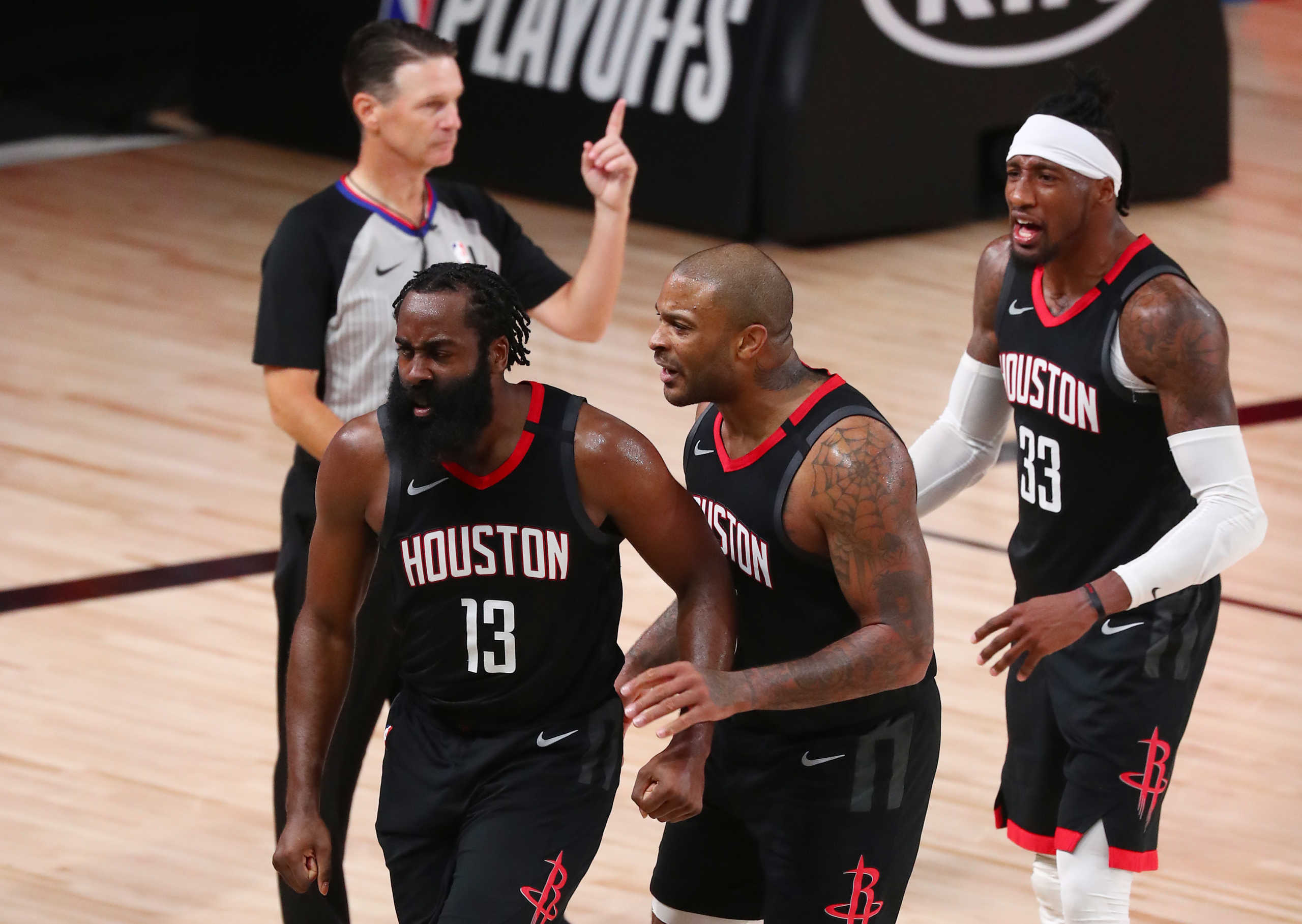 Sep 2, 2020; Lake Buena Vista, Florida, USA; Houston Rockets guard James Harden (13) reacts with forward P.J. Tucker (17) and forward Robert Covington (right)  after a play against the Oklahoma City Thunder during the second half of game seven of the first round of the 2020 NBA Playoffs at ESPN Wide World of Sports Complex. Mandatory Credit: Kim Klement-USA TODAY Sports