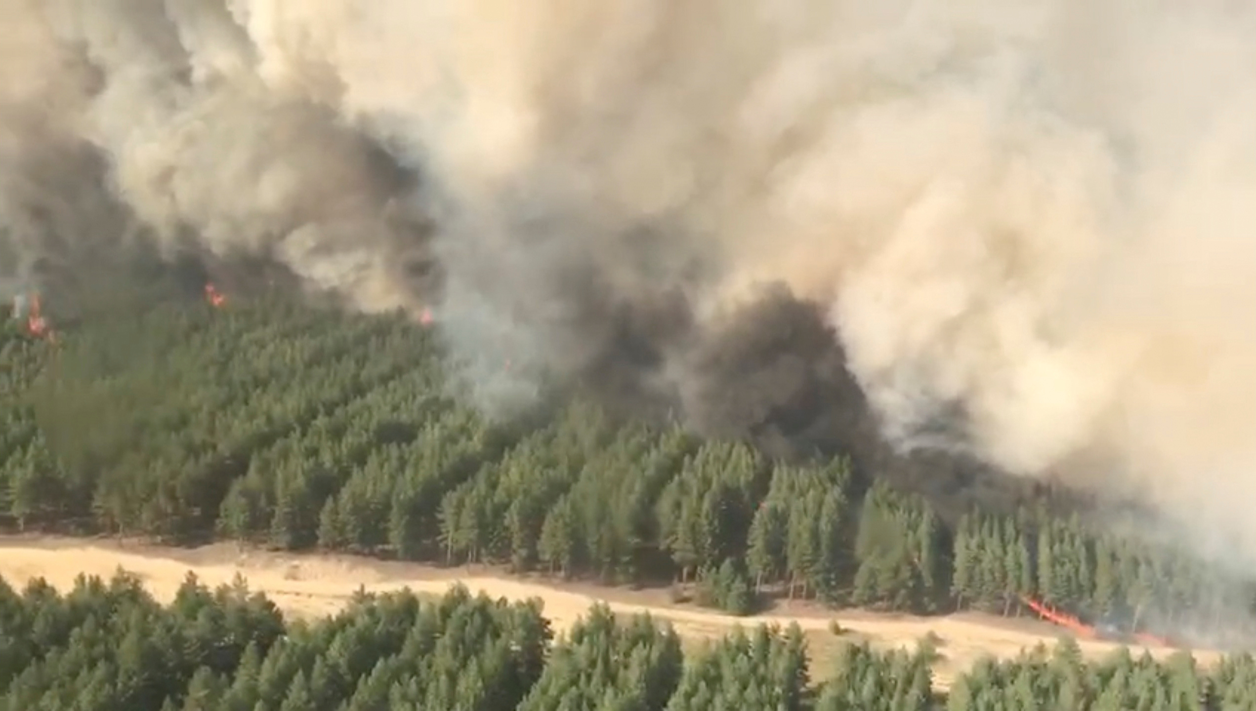An aerial view shows smoke rising from a wildfire in Rostov Region, Russia, in this still image taken from a video dated September 2, 2020. Video taken September 2, 2020. Russian Emergencies Ministry