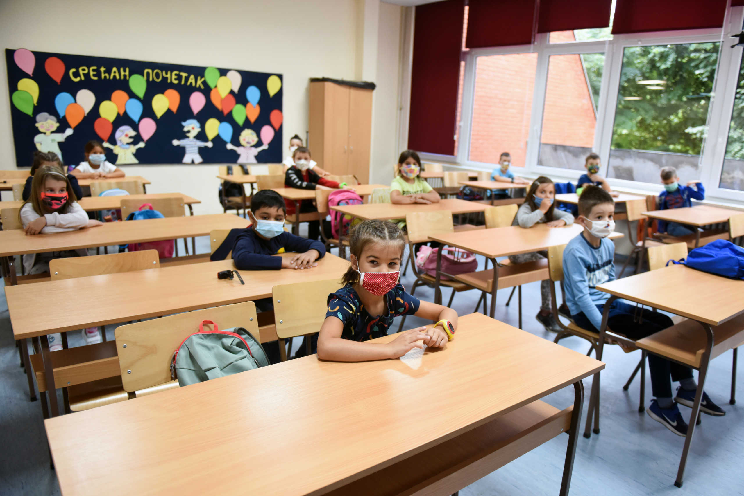Primary school pupils wear protective masks during their first day after the summer holidays, amid the spread of the coronavirus disease (COVID-19), in Belgrade, Serbia, September 01, 2020. REUTERS