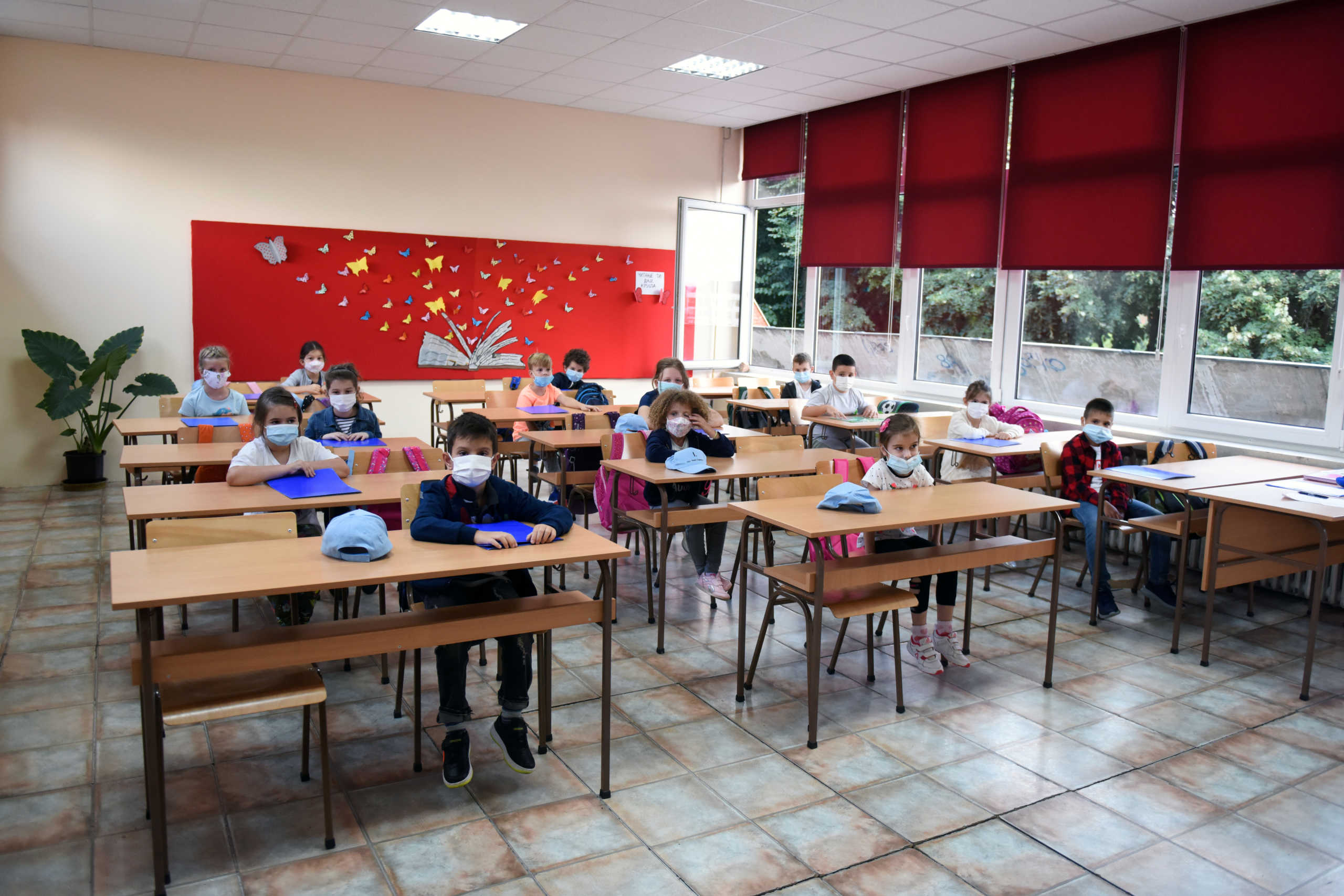 Primary school pupils wear protective masks during their first day after the summer holidays, amid the spread of the coronavirus disease (COVID-19), in Belgrade, Serbia, September 01, 2020. REUTERS