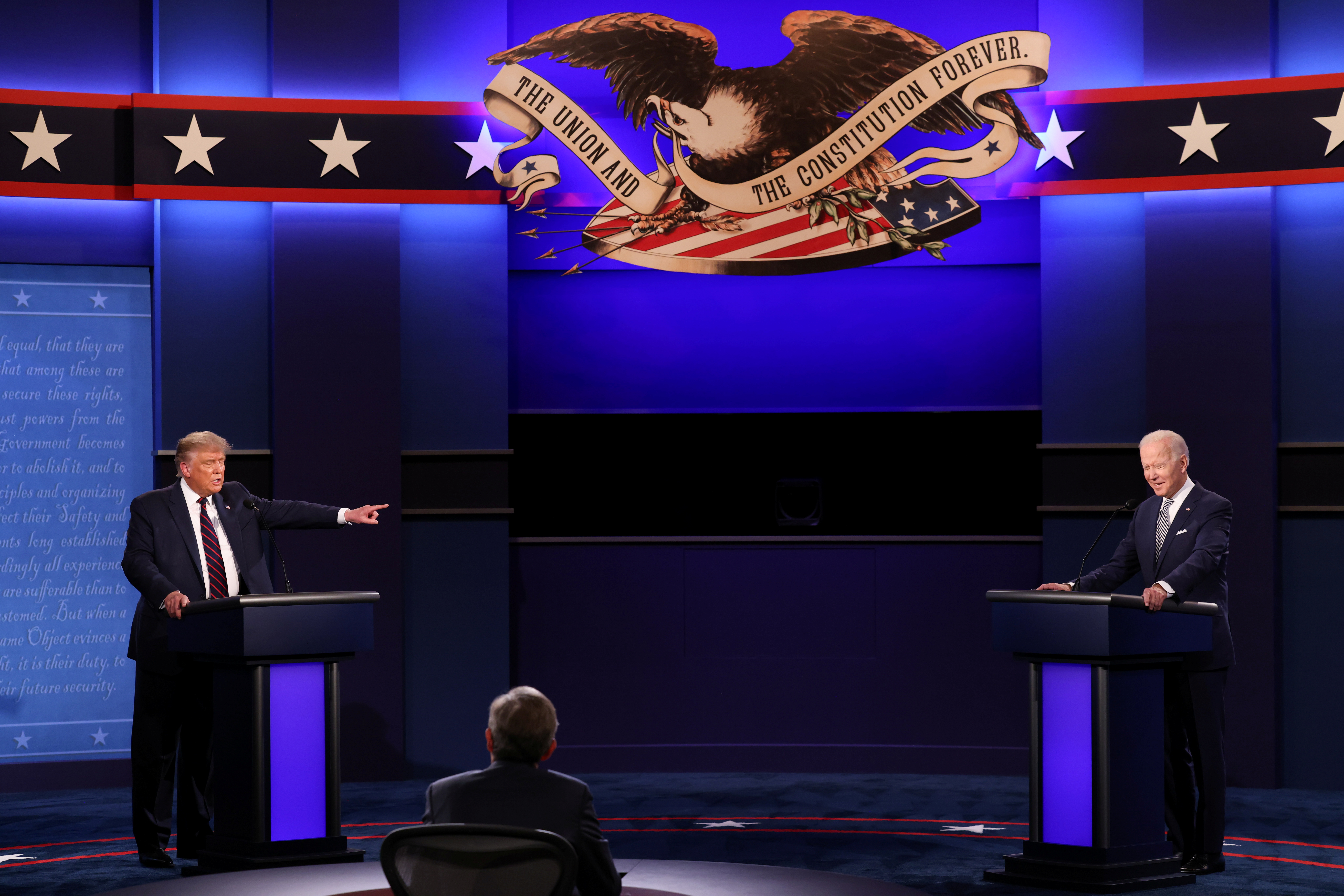 U.S. President Donald Trump and Democratic presidential nominee Joe Biden participate in their first 2020 presidential campaign debate held on the campus of the Cleveland Clinic at Case Western Reserve University in Cleveland, Ohio, U.S., September 29, 2020. REUTERS