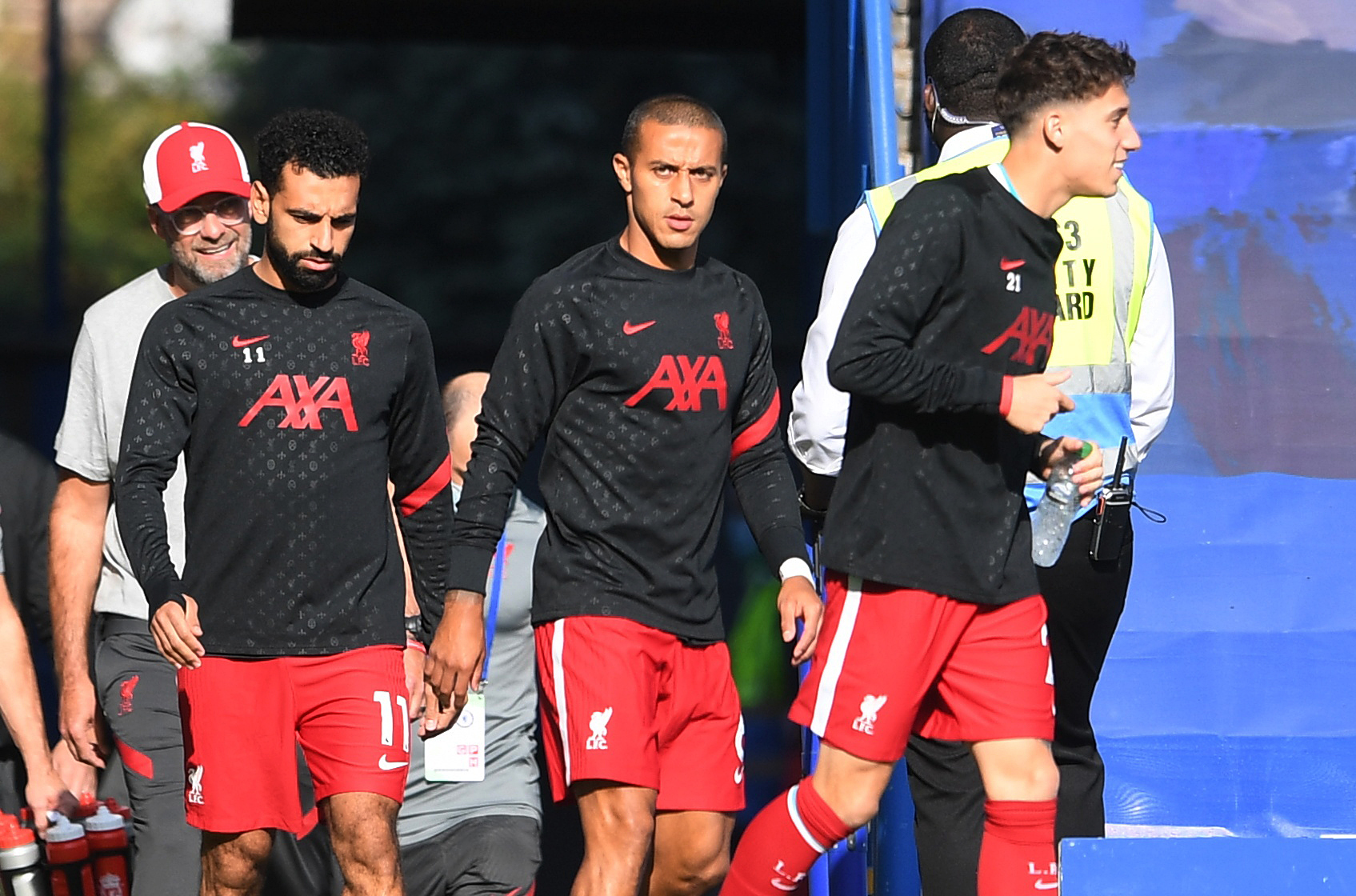 Soccer Football - Premier League - Chelsea v Liverpool - Stamford Bridge, London, Britain - September 20, 2020 Liverpool's Thiago, Mohamed Salah and Konstantinos Tsimikas during the warm up before the match Pool via REUTERS