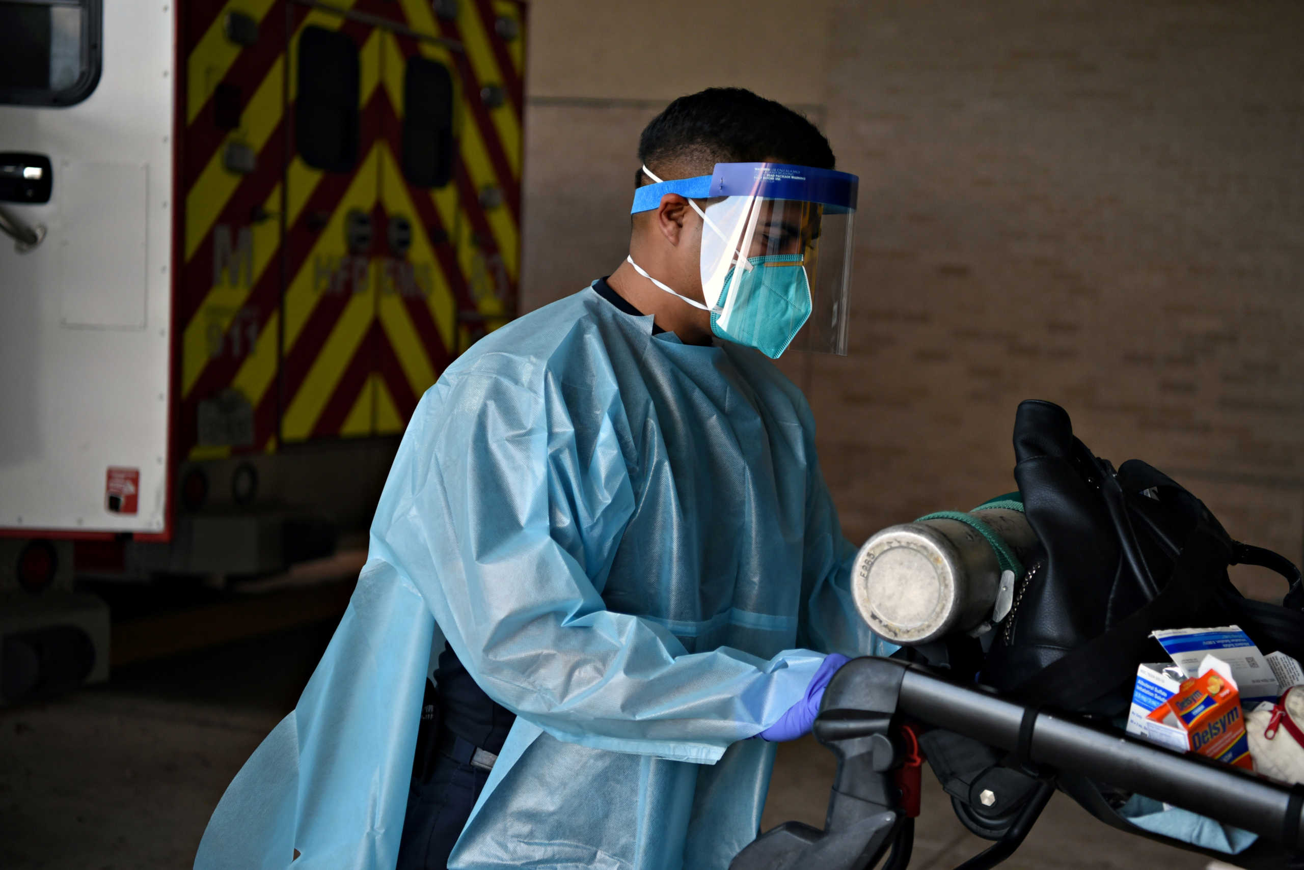 Pedro Hinojosa tends to a non-COVID-19 patient while wearing protective equipment against the spread of the coronavirus disease (COVID-19) in Houston, Texas, U.S., August 23, 2020.  REUTERS