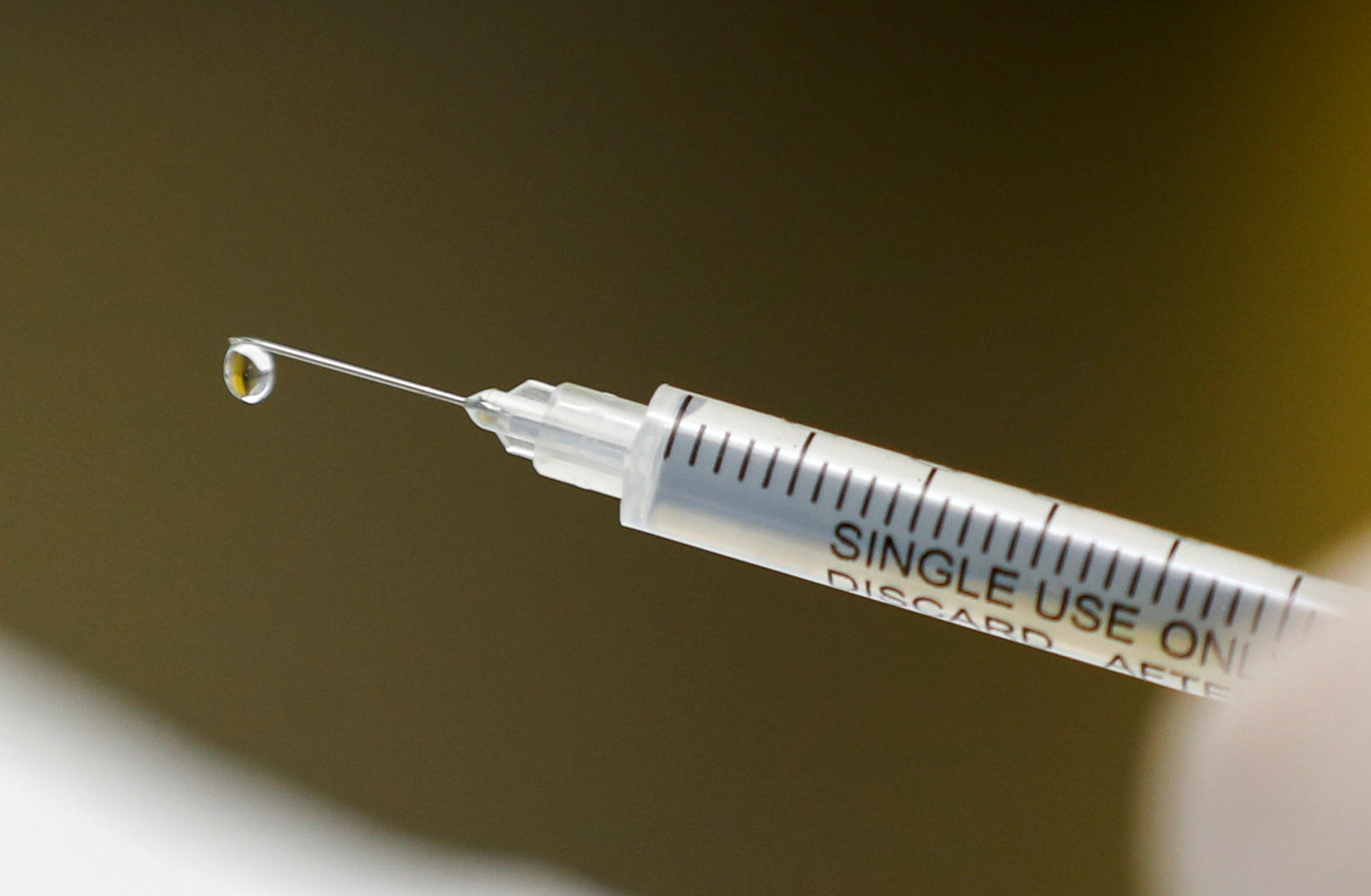 A syringe with a vaccine is seen ahead of trials by volunteers testing for the coronavirus disease (COVID-19), and taking part in the country's human clinical trial for potential vaccines at the Wits RHI Shandukani Research Centre in Johannesburg, South Africa, August 27, 2020. Picture taken August 27, 2020. REUTERS