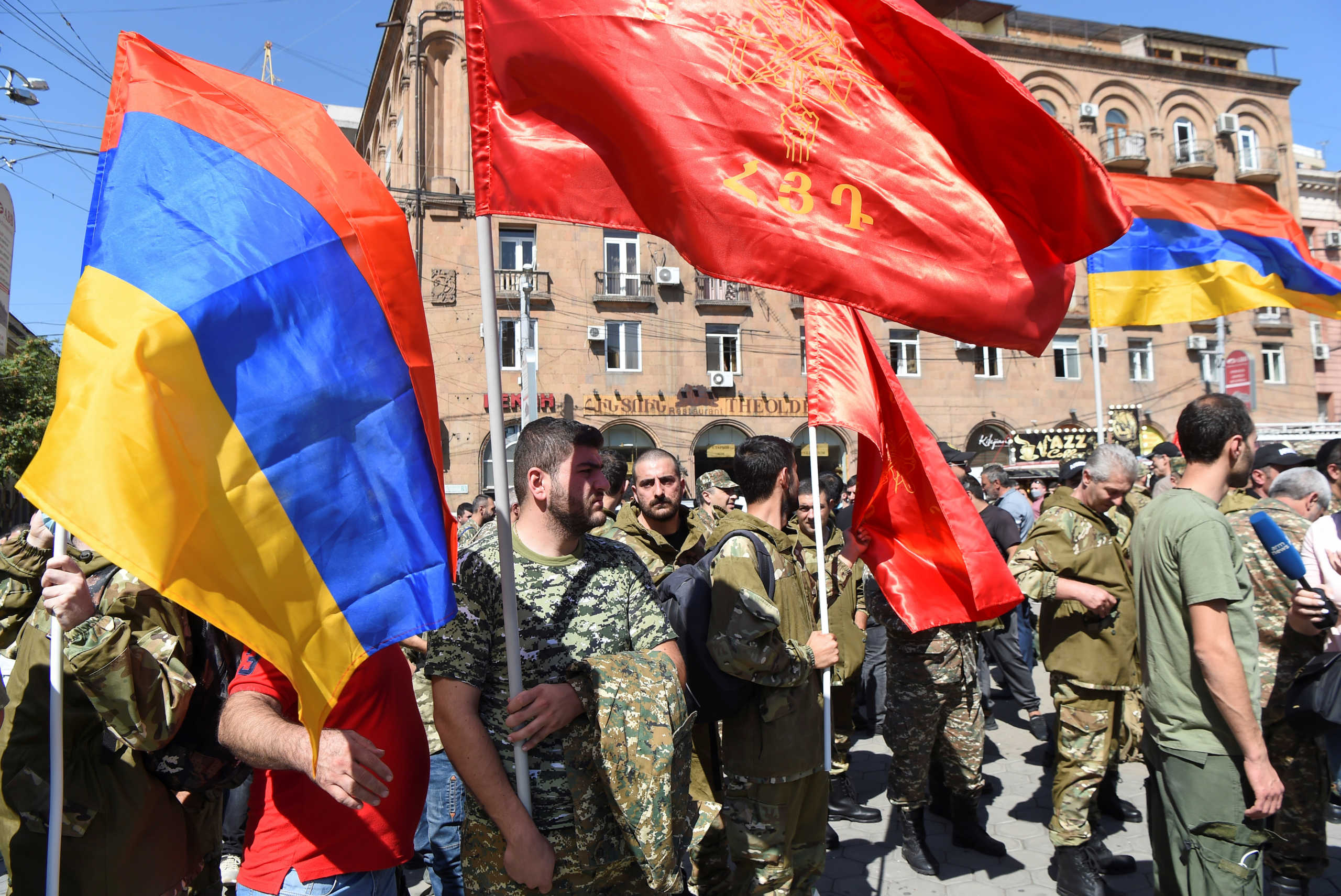 People attend a meeting to recruit military volunteers after Armenian authorities declared martial law and mobilised its male population following clashes with Azerbaijan over the breakaway Nagorno-Karabakh region in Yerevan, Armenia September 27, 2020. Melik Baghdasaryan