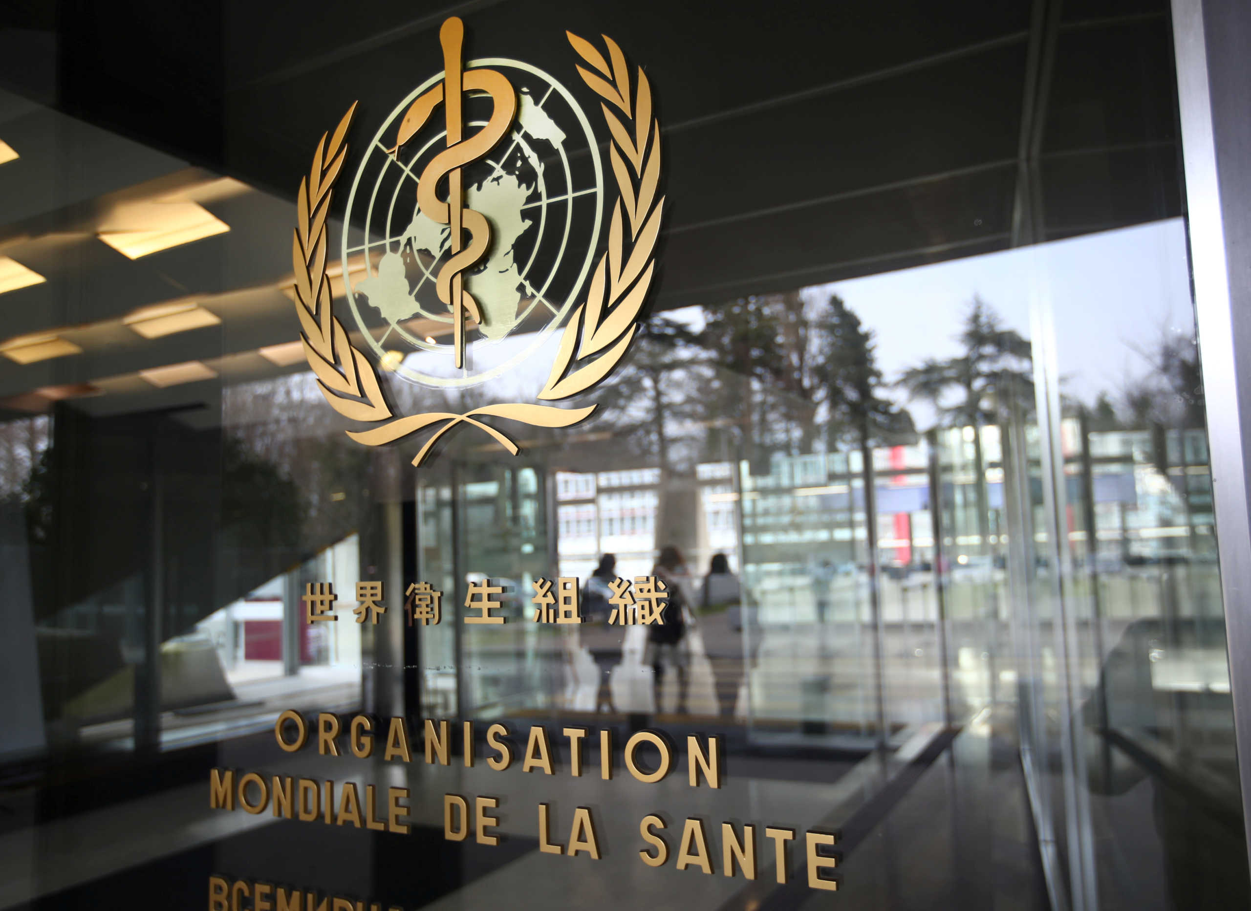 FILE PHOTO: A logo is pictured outside a building of the World Health Organization (WHO) during an executive board meeting on update on the coronavirus outbreak, in Geneva, Switzerland, February 6, 2020. REUTERS