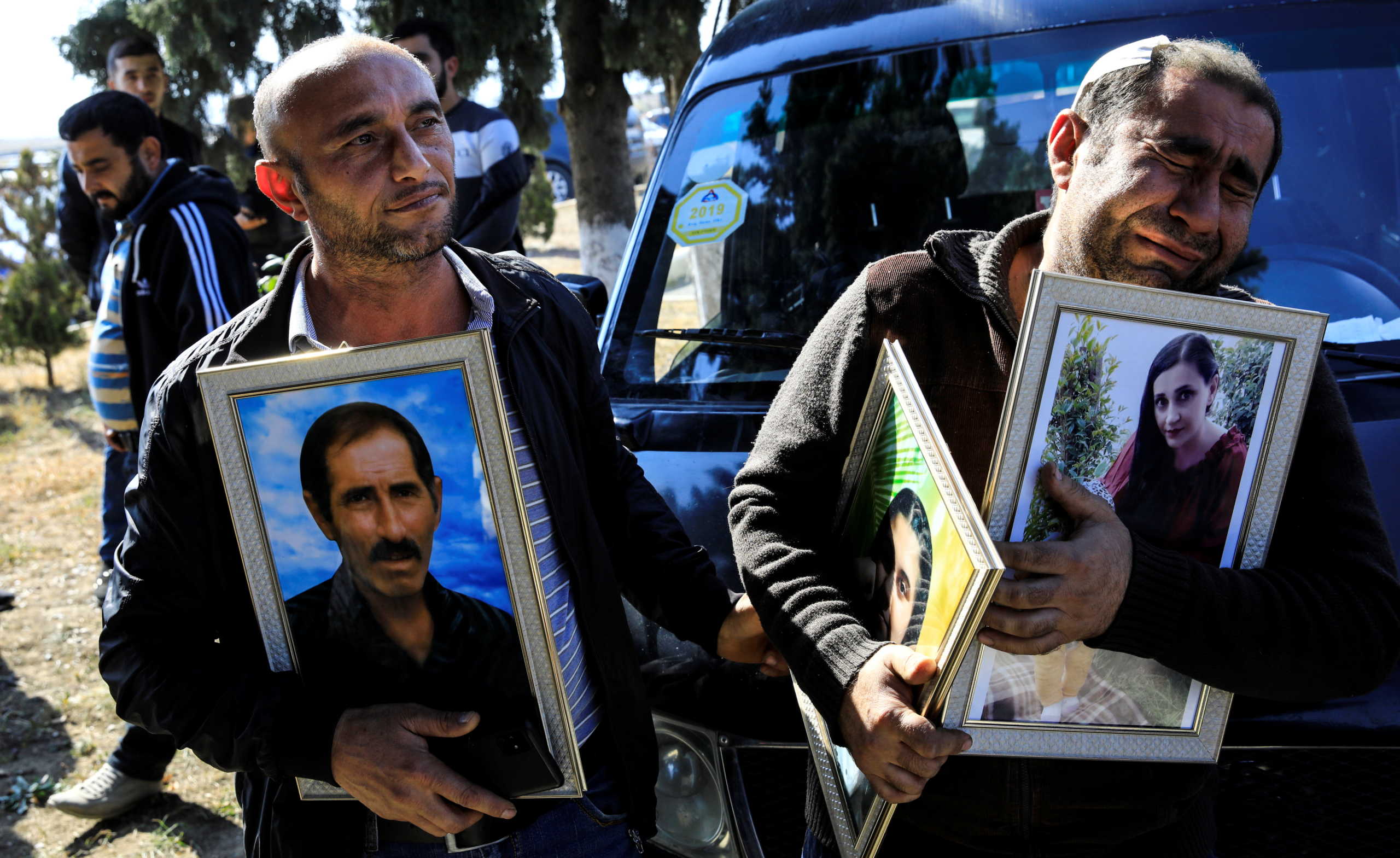 Members of Asgerov family mourn for their five relatives who died when a rocket hit their home during the fighting over the breakaway region of Nagorno-Karabakh, in the city of Ganja, Azerbaijan October 17, 2020. REUTERS