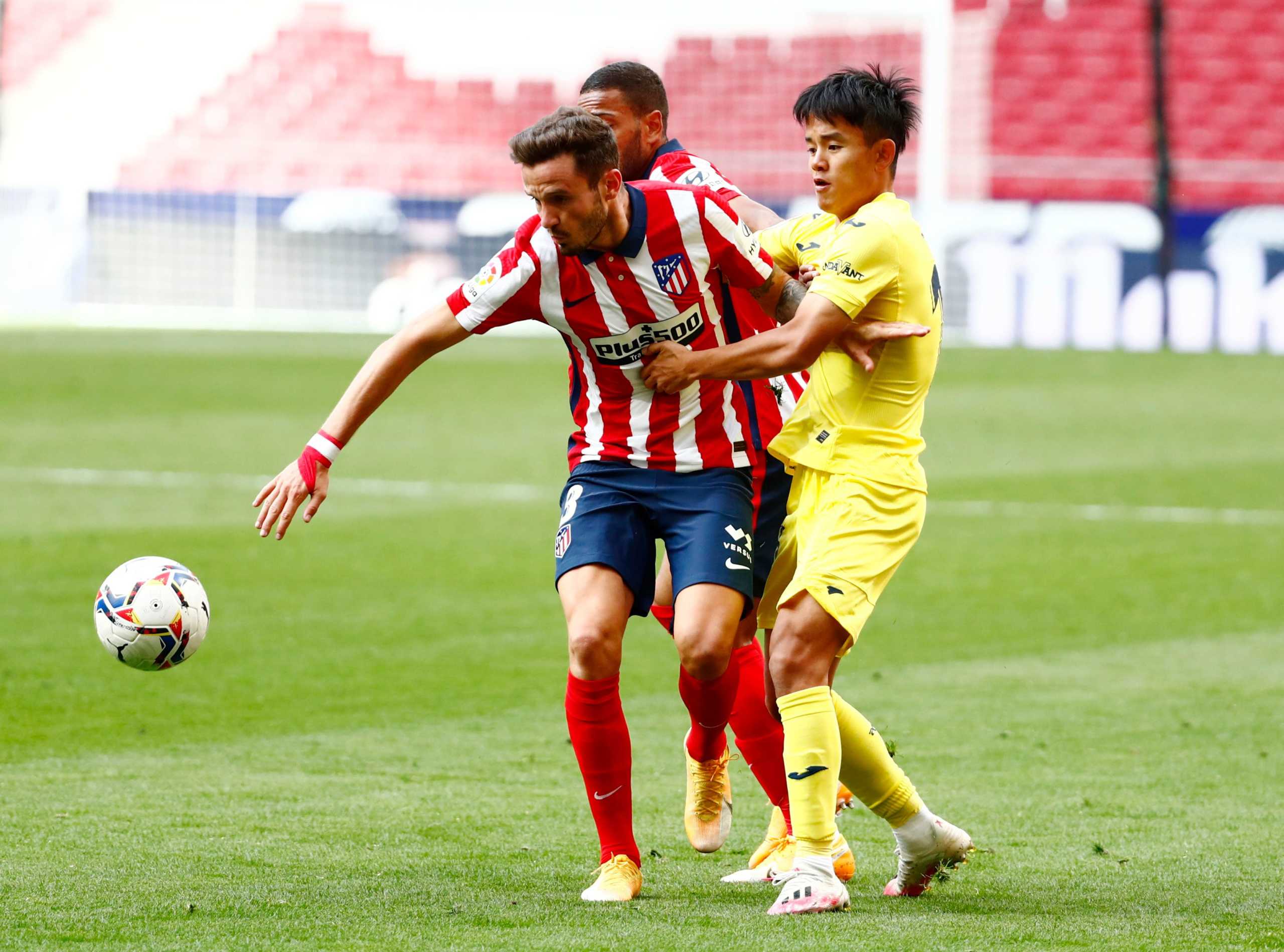 Soccer Football - La Liga Santander - Atletico Madrid v Villarreal - Wanda Metropolitano, Madrid, Spain - October 3, 2020 Villarreal's Takefusa Kubo in action with Atletico Madrid's Saul Niguez REUTERS