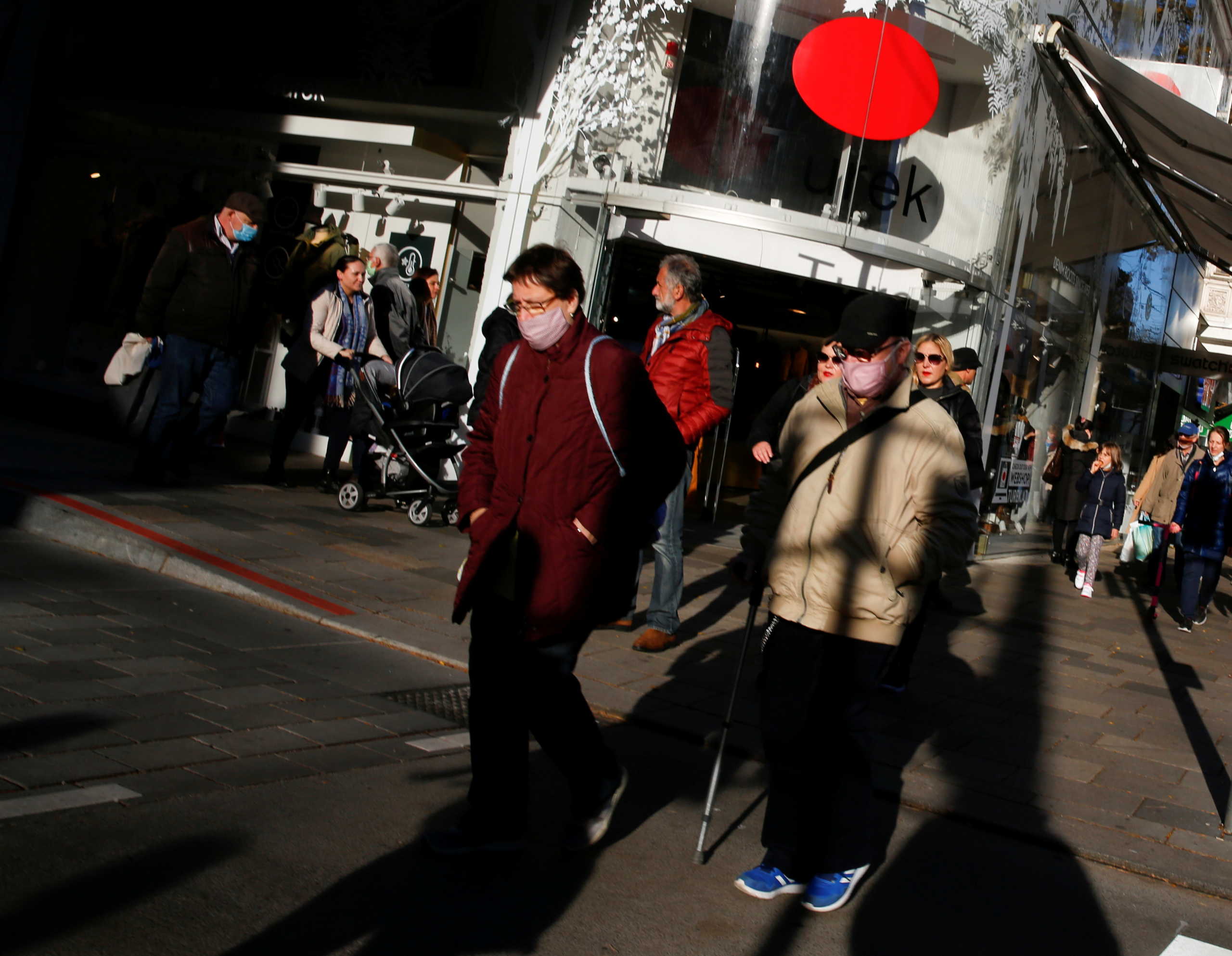 People wearing protective face masks walk in a pedestrian street as the coronavirus disease (COVID-19) outbreak continues in Vienna, Austria October 28, 2020.   REUTERS
