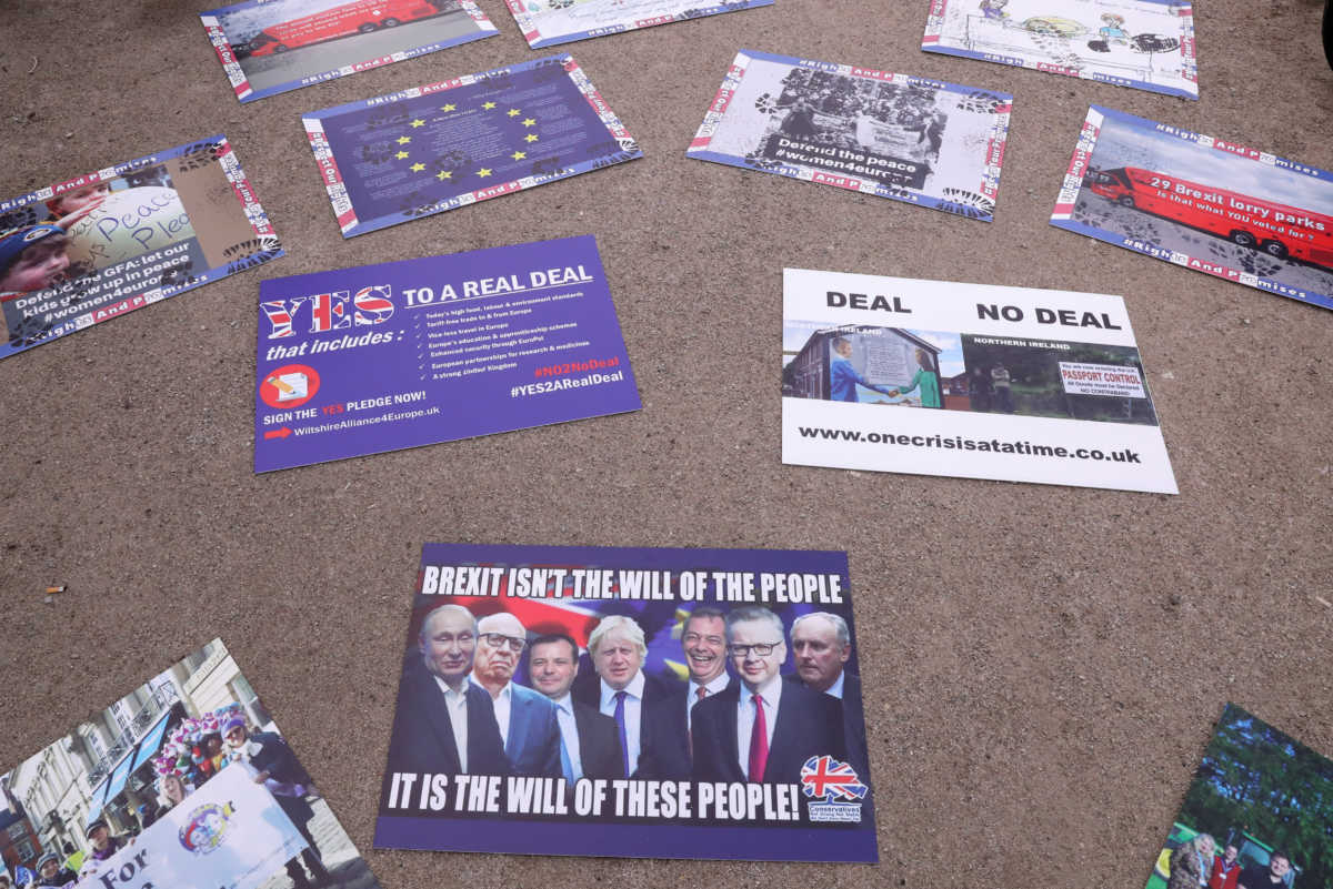 Anti-Brexit placards lay on the ground, ahead of a European Union leaders summit, in Brussels, Belgium October 15, 2020. REUTERS