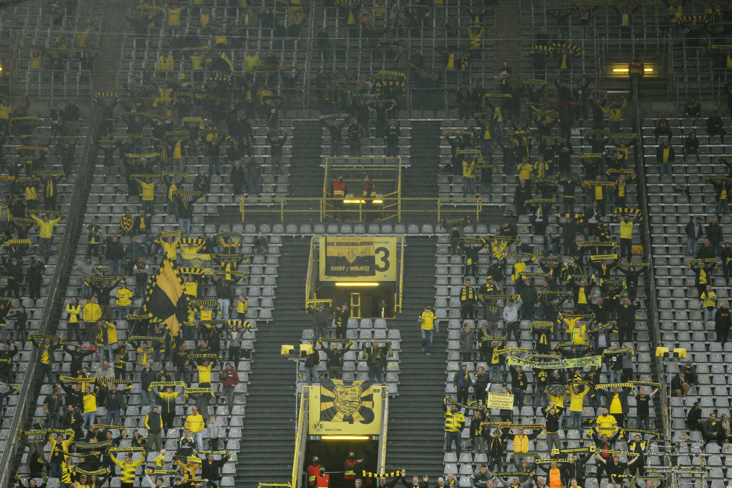 Soccer Football - Bundesliga - Borussia Dortmund v SC Freiburg - Signal Iduna Park, Dortmund, Germany - October 3, 2020. Borussia Dortmund fans practising social distancing in the stands REUTERS