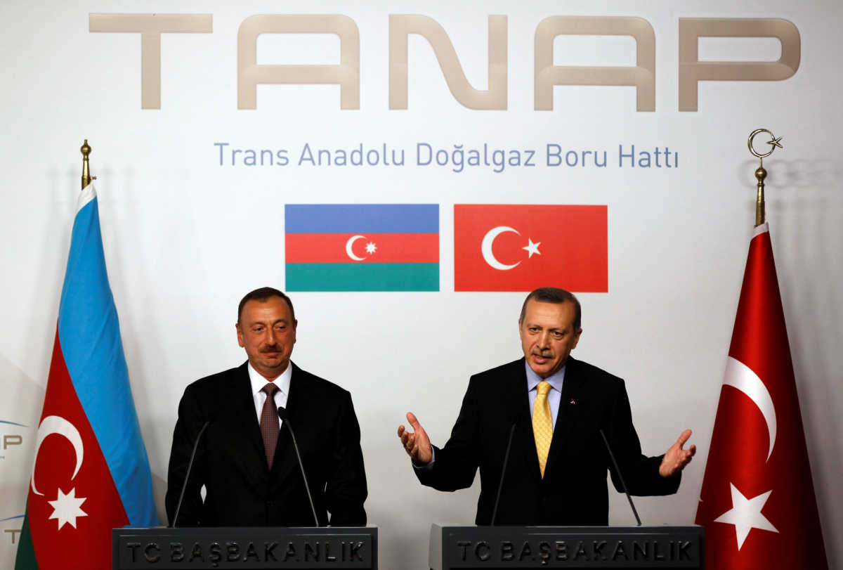 FILE PHOTO: Turkey's Prime Minister Tayyip Erdogan (R) speaks as Azerbaijan's President Ilham Aliyev listens during a news conference following a signing ceremony in Istanbul June 26, 2012. REUTERS