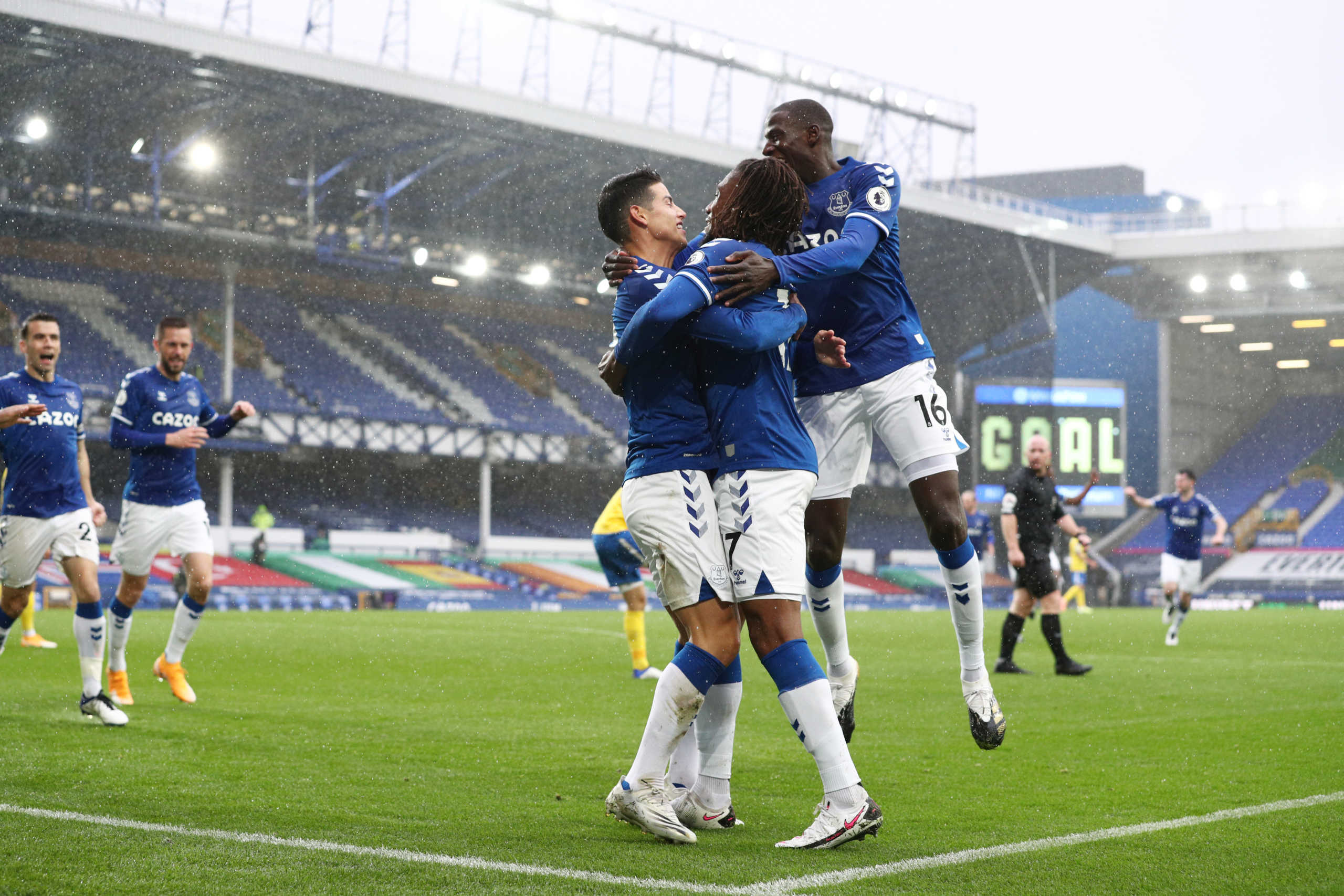 Soccer Football - Premier League - Everton v Brighton & Hove Albion - Goodison Park, Liverpool, Britain - October 3, 2020 Everton's James Rodríguez celebrates scoring their third goal with Abdoulaye Doucoure and Alex Iwobi Pool via REUTERS