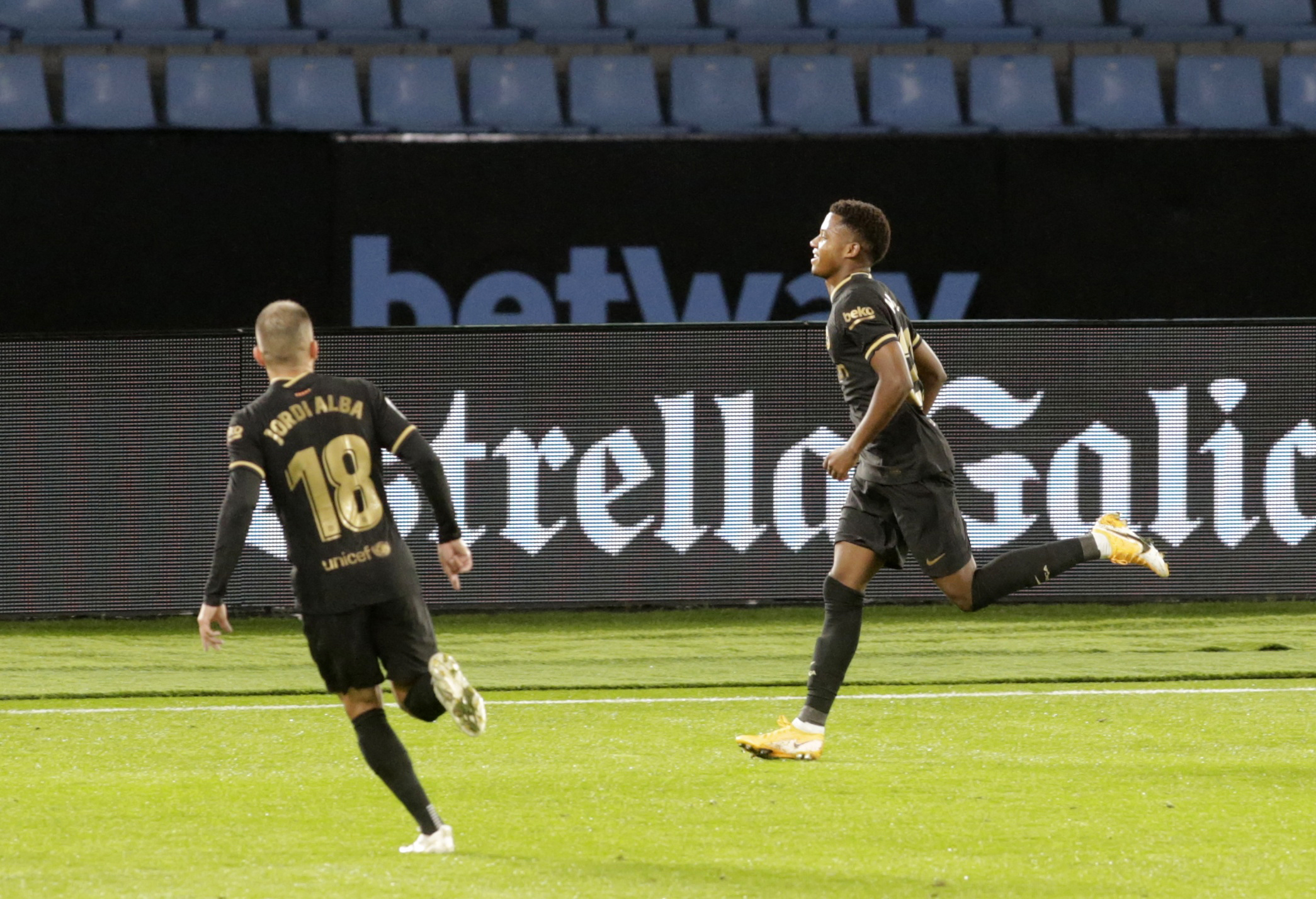 Soccer Football - La Liga Santander - Celta Vigo v FC Barcelona - Estadio de Balaidos, Vigo, Spain - October 1, 2020. Barcelona’s Ansu Fati celebrates scoring their first goal with Jordi Alba. REUTERS