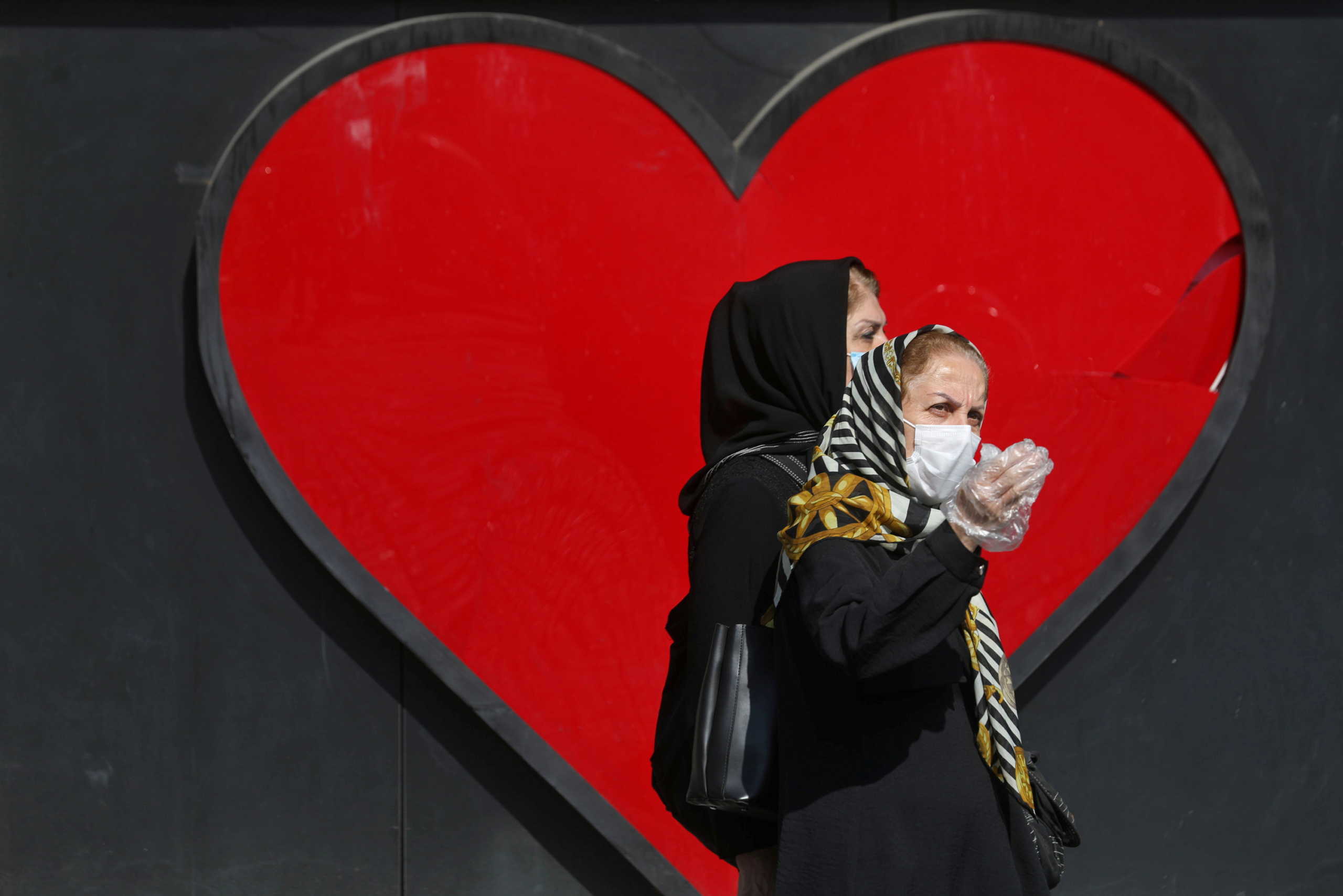 Iranian women wear masks, amid a rise in the coronavirus disease (COVID-19) infections, in Tehran, Iran October 24, 2020. Picture taken October 24, 2020. Majid Asgaripour