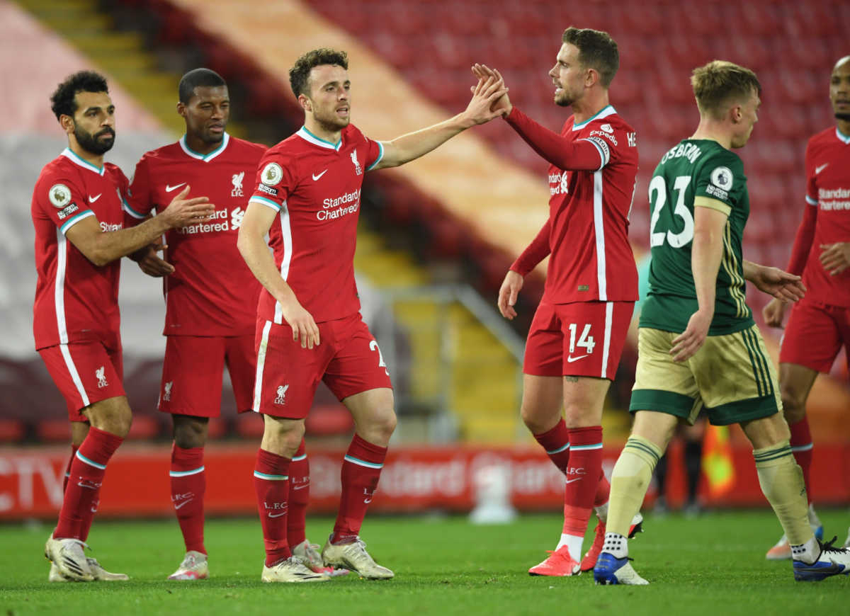 Soccer Football - Premier League - Liverpool v Sheffield United - Anfield, Liverpool, Britain - October 24, 2020 Liverpool's Diogo Jota celebrates scoring their second goal with teammates Pool via REUTERS