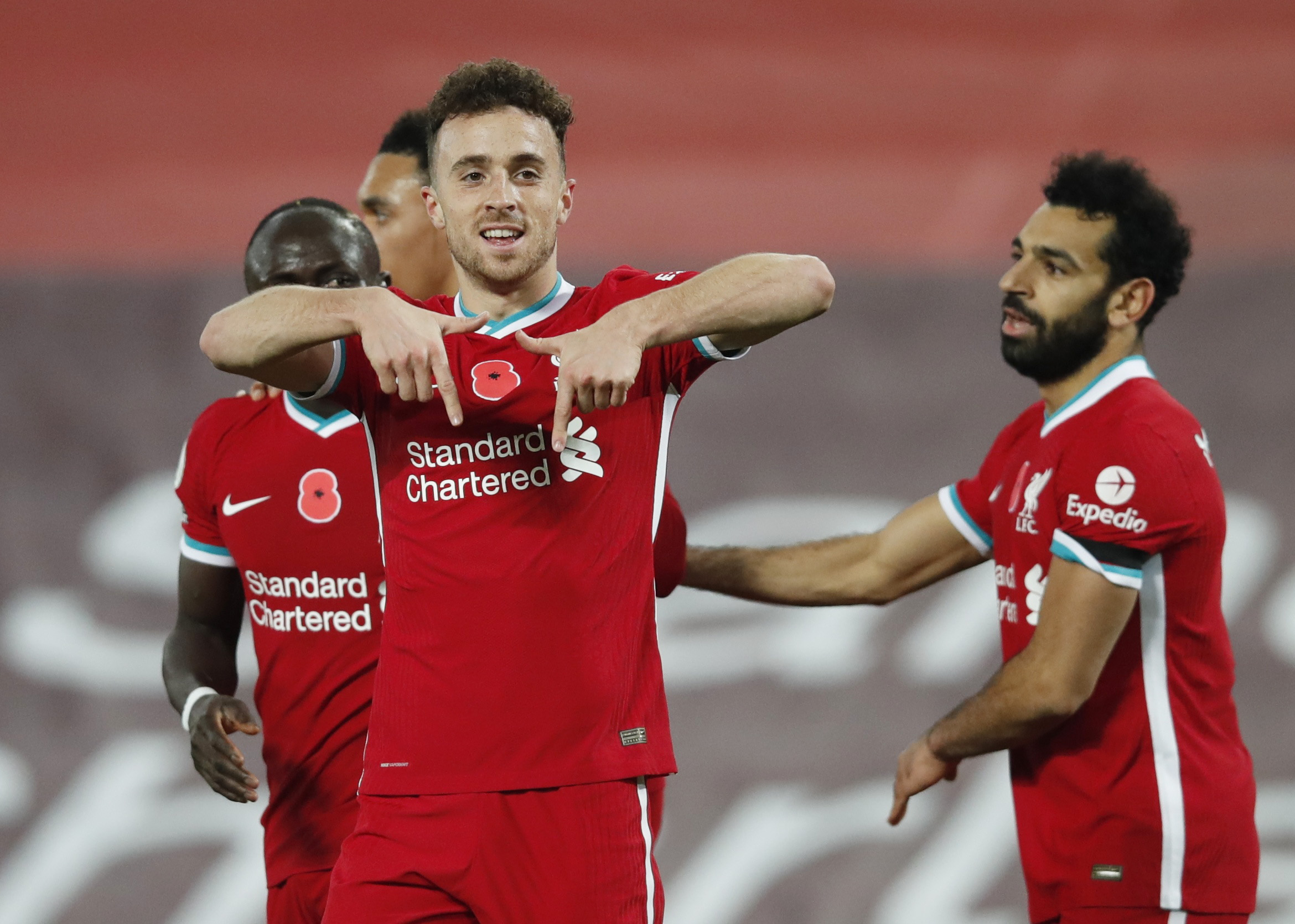Soccer Football - Premier League - Liverpool v West Ham United - Anfield, Liverpool, Britain - October 31, 2020  Liverpool's Diogo Jota celebrates scoring their second goal with teammates Pool via REUTERS