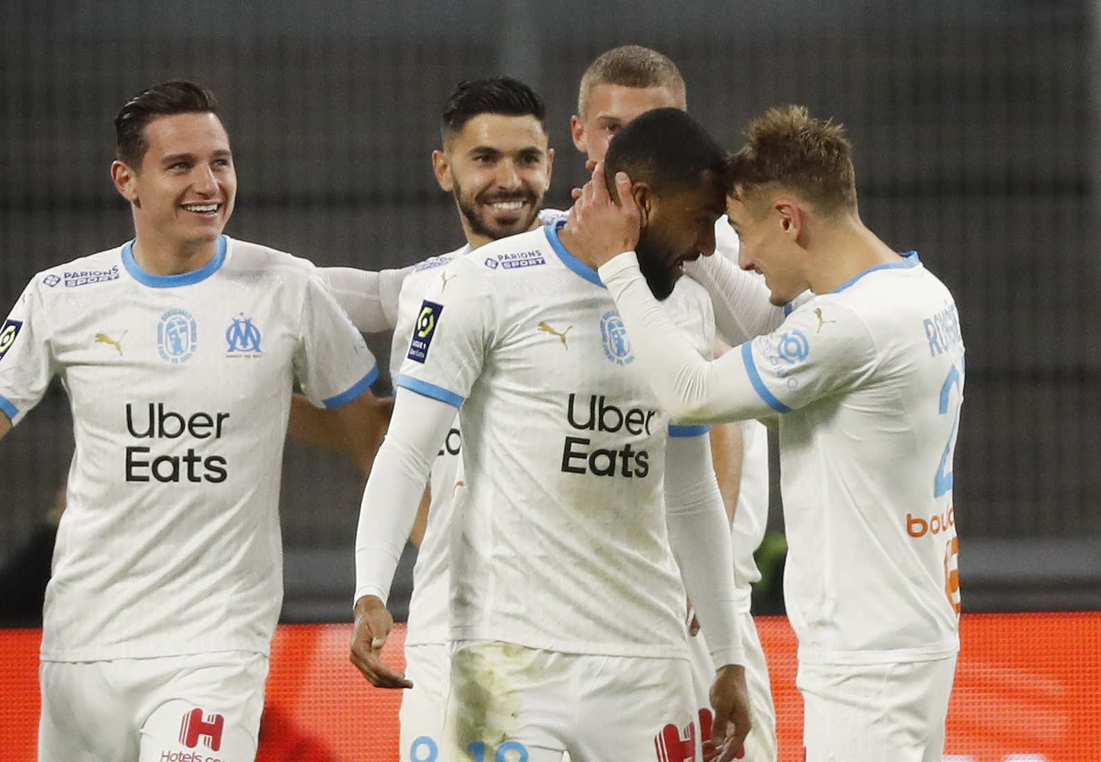 Soccer Football - Ligue 1 - Olympique de Marseille v Bordeaux - Orange Velodrome, Marseille, France - October 17, 2020  Olympique de Marseille's Jordan Amavi celebrates scoring their second goal with teammates REUTERS