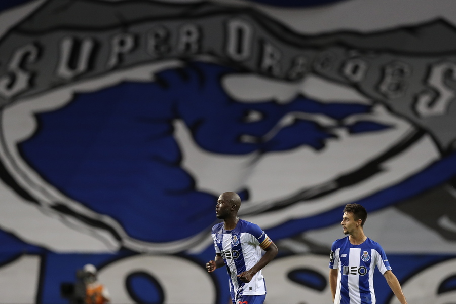 epa08548612 FC Porto's Danilo Pereira (L) celebrates after scoring a goal against Sporting during the Portuguese First League soccer match between FC Porto and Sporting CP held at Dragao stadium in Porto, Portugal, 15 July 2020.  EPA