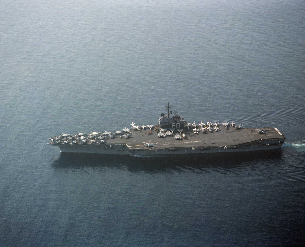 An elevated port beam view of the aircraft carrier USS SARATOGA (CV 60) underway.