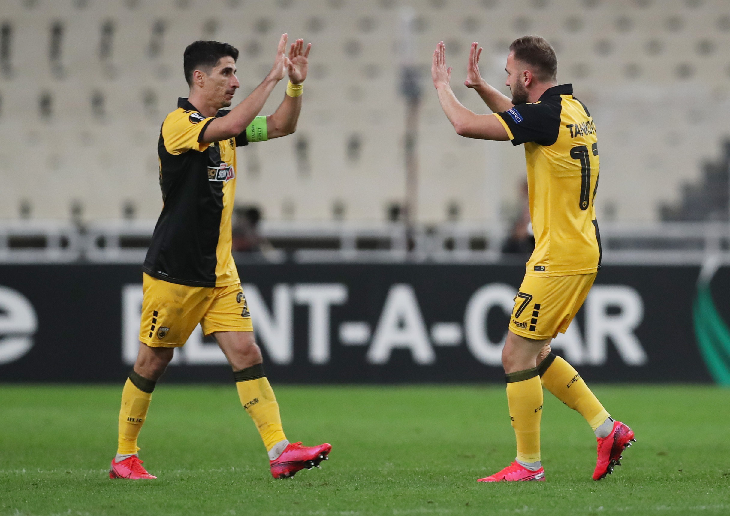 Soccer Football - Europa League - Group G - AEK Athens v Leicester City - OAKA Spiros Louis, Athens, Greece - October 29, 2020 AEK Athens' Muamer Tankovic celebrates scoring their first goal with Petros Mantalos REUTERS