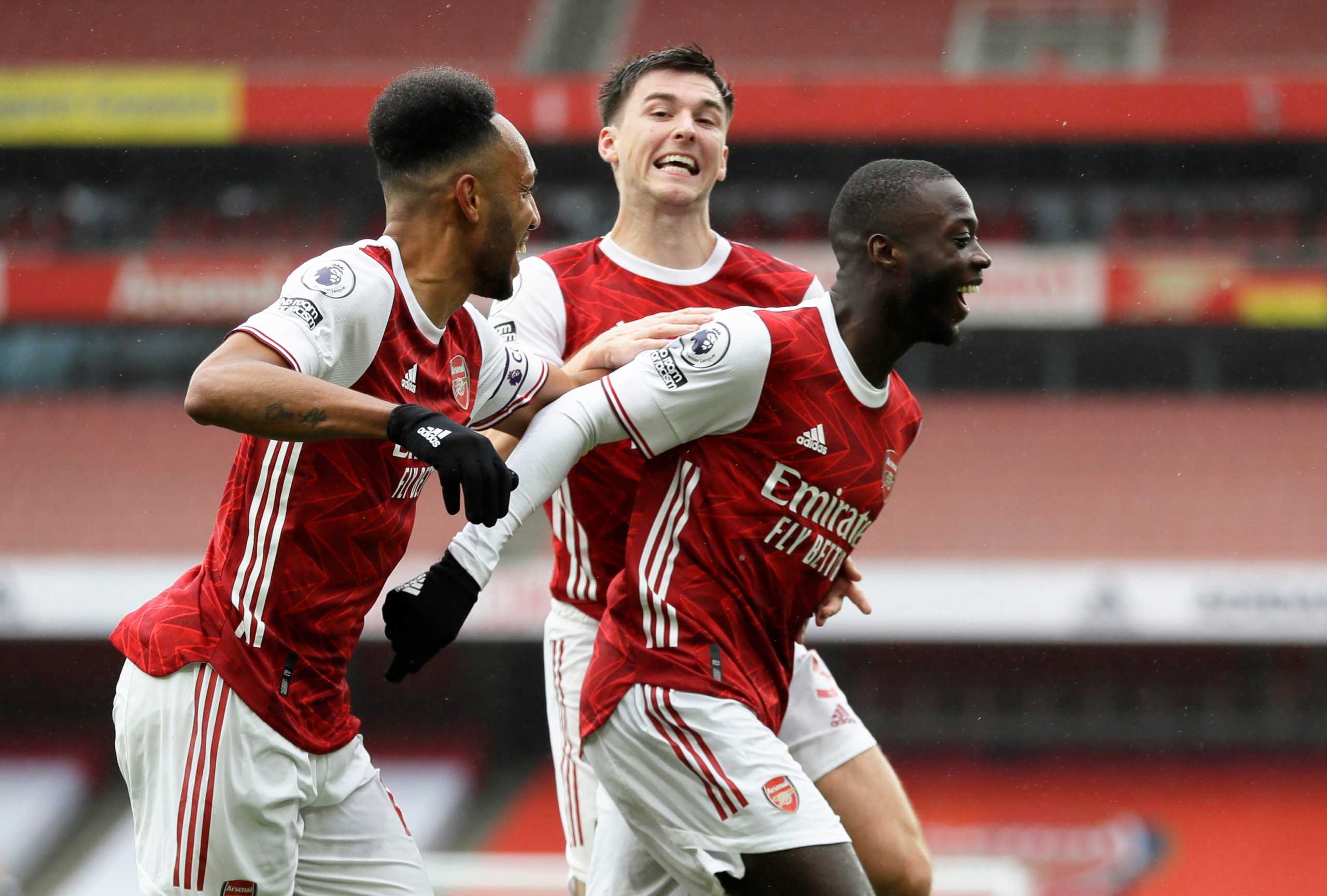 Soccer Football - Premier League - Arsenal v Sheffield United - Emirates Stadium, London, Britain - October 4, 2020 Arsenal's Nicolas Pepe celebrates scoring their second goal with Pierre-Emerick Aubameyang and Kieran Tierney Pool via REUTERS